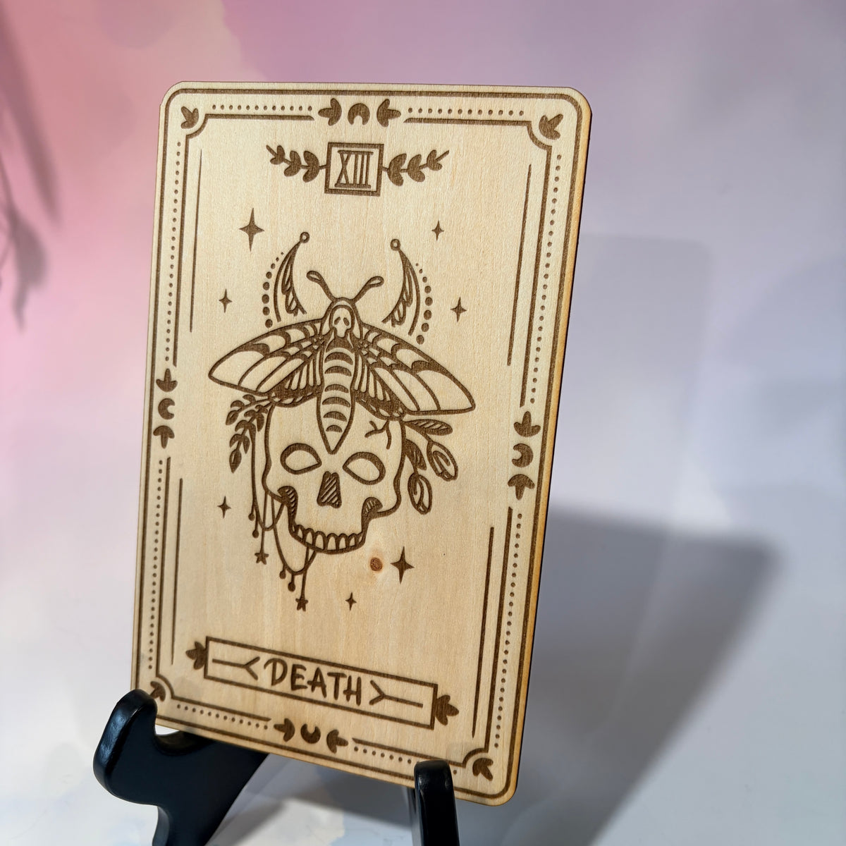 Laser-engraved wooden tarot card made from 3mm basswood, approximately 7 x 5 inches. Available in all 22 Major Arcana designs with customizable colors and an optional display stand for an additional $2.
