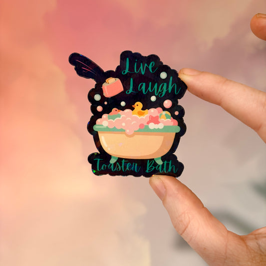 Holographic Live Laugh Toaster Bath vinyl sticker with bathtub, bubbles, rubber duck, and flying toaster.
