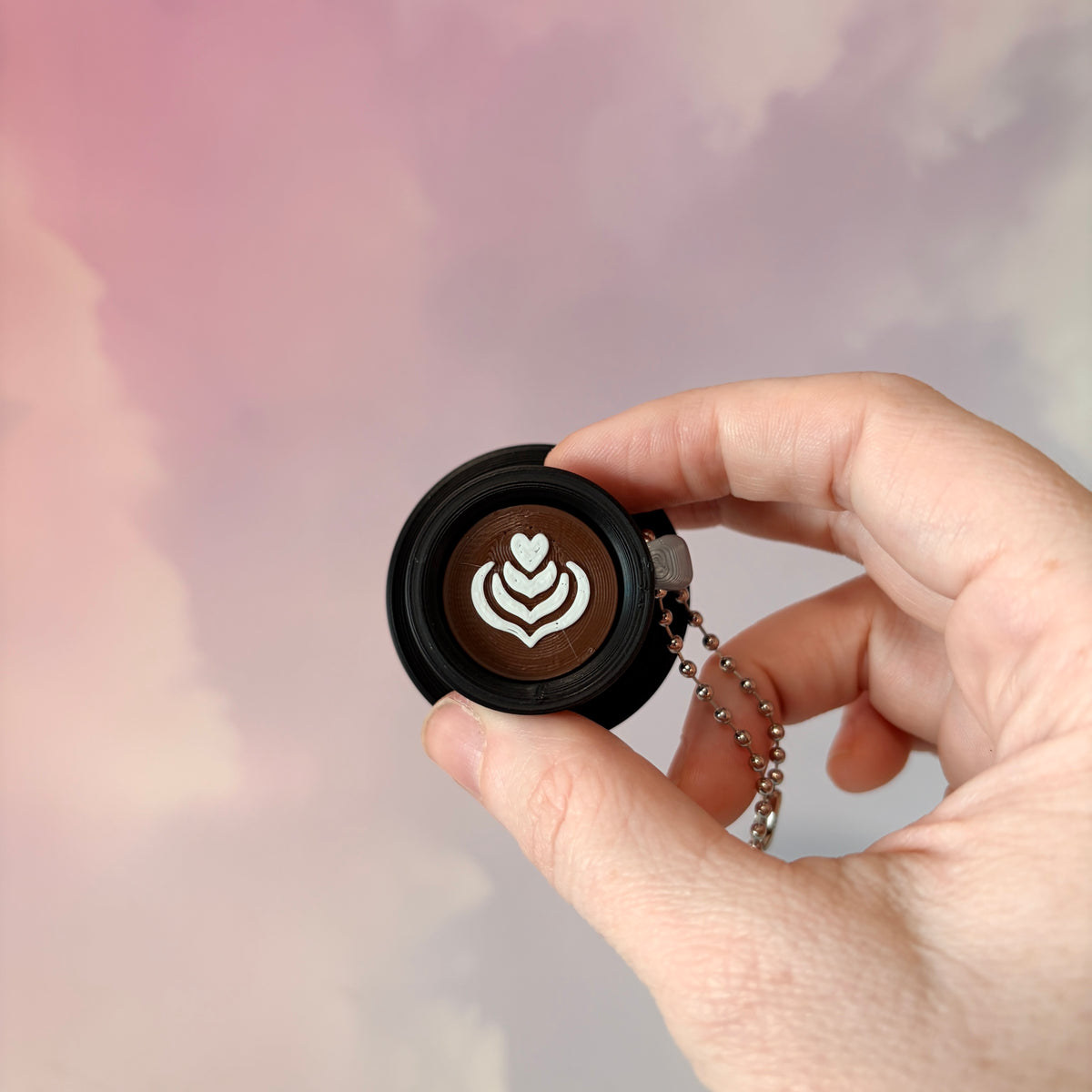 3D printed mystical drink cup fidget clicker keychain with a black floral moon design in gold or silver. Choose matcha or coffee with cute latte art, plus a clicky or silent mechanism.