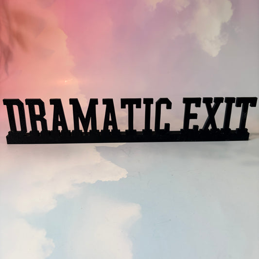 3D printed “DRAMATIC EXIT” sign measuring approximately 15 inches long by 3 inches tall. Available in a variety of colors and includes Command strips for wall mounting. Funny decor for offices, bedrooms, and doorways.