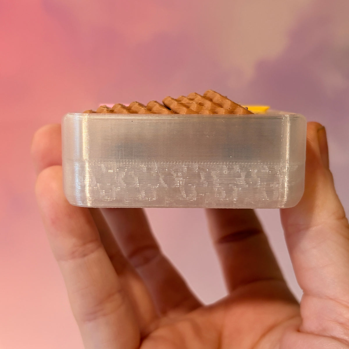 3D printed mini snack box fidget clicker with ham, cheese, and crackers under a semi-transparent lid. Ham and cheese have soft silent presses, while the crackers make satisfying audible clicks.