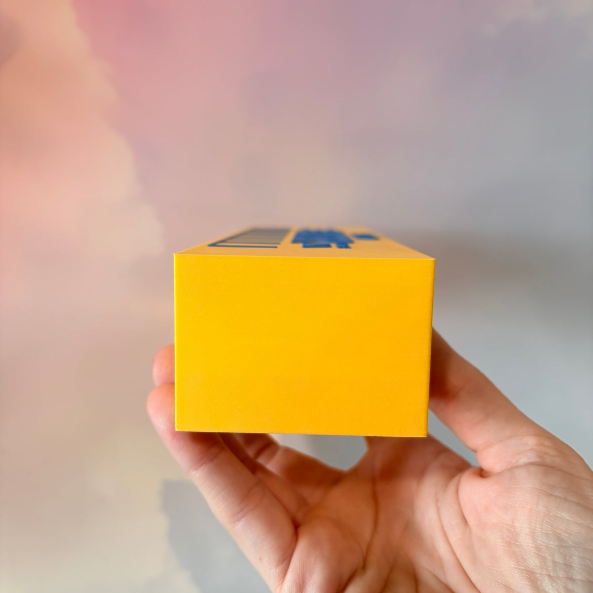 Oversized 3D printed novelty stick of butter, approximately 8.5 inches long, featuring classic tablespoon measurement lines, Grade AA labeling, and net weight details. Whimsical food-themed decor for kitchens and farmhouse-style homes.