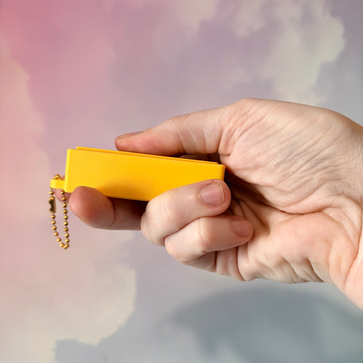3D printed stick of butter fidget clicker keychain with classic tablespoon marking lines, gold-tone hardware, and two satisfying clicky key switches, perfect for foodies and whimsical accessory lovers.