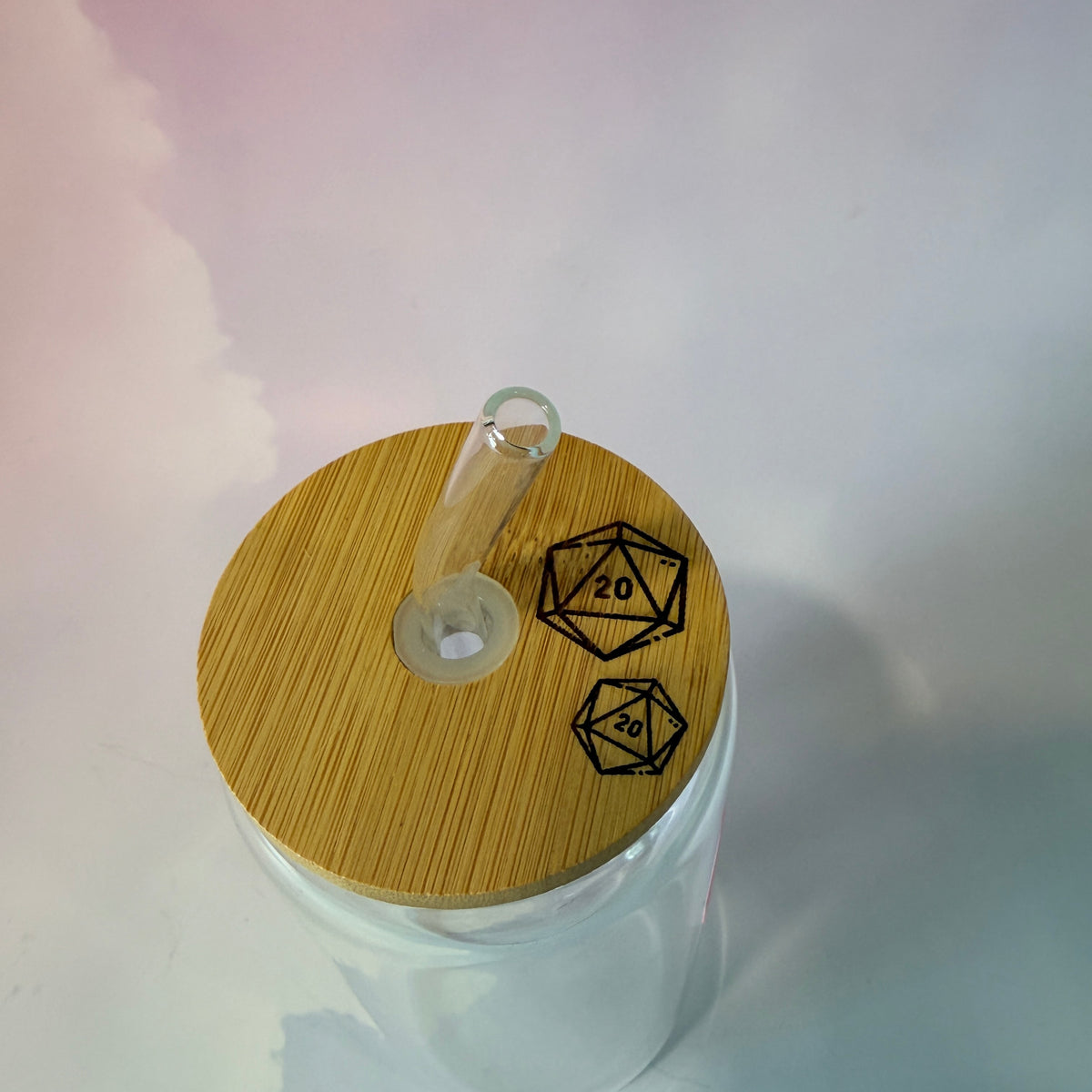 16 oz Dungeons and Dragons glass coffee can with vinyl fantasy design, bamboo lid engraved with two D20 dice, and straw. Custom colors available. Handwash only; not dishwasher or microwave safe.