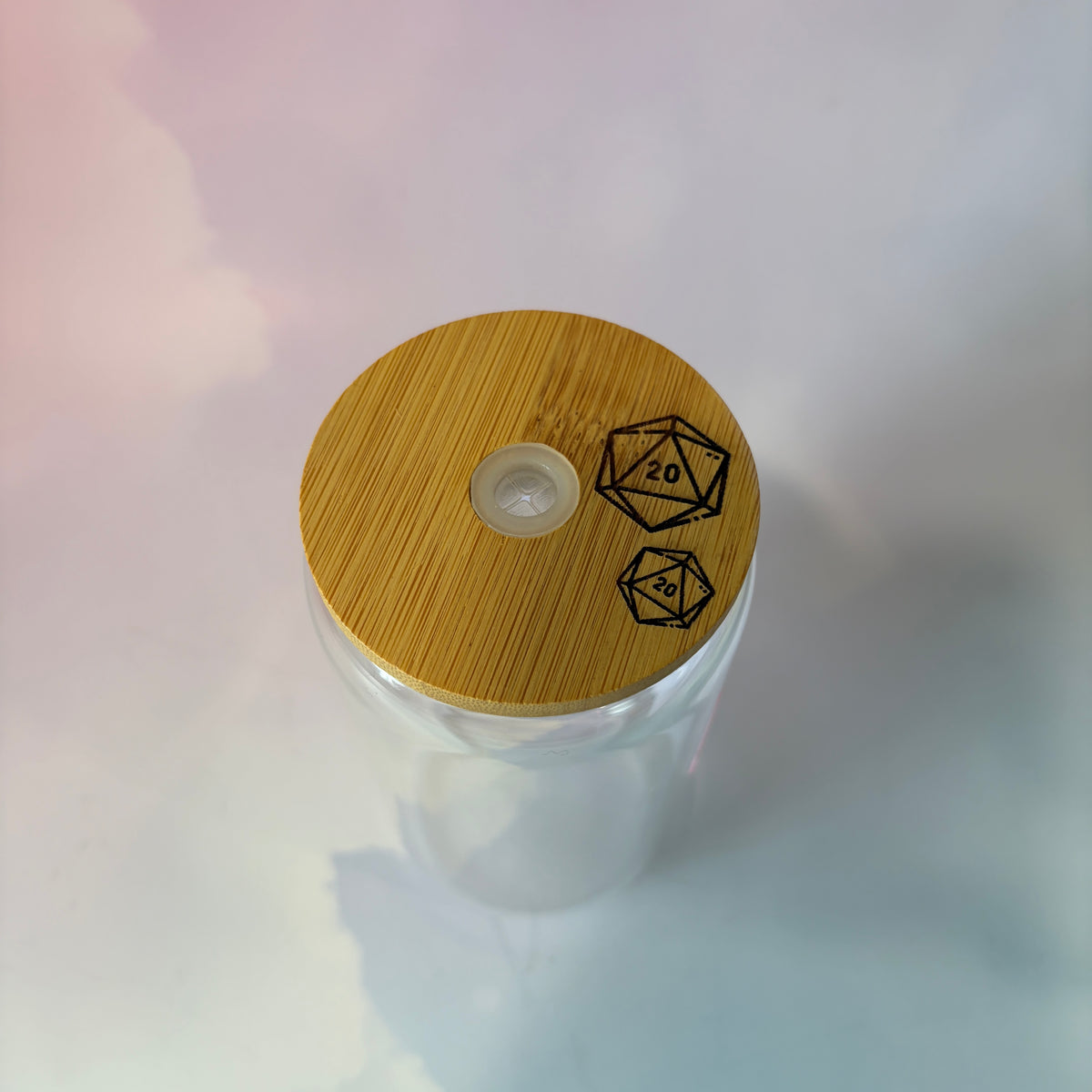 16 oz Dungeons and Dragons glass coffee can with vinyl fantasy design, bamboo lid engraved with two D20 dice, and straw. Custom colors available. Handwash only; not dishwasher or microwave safe.