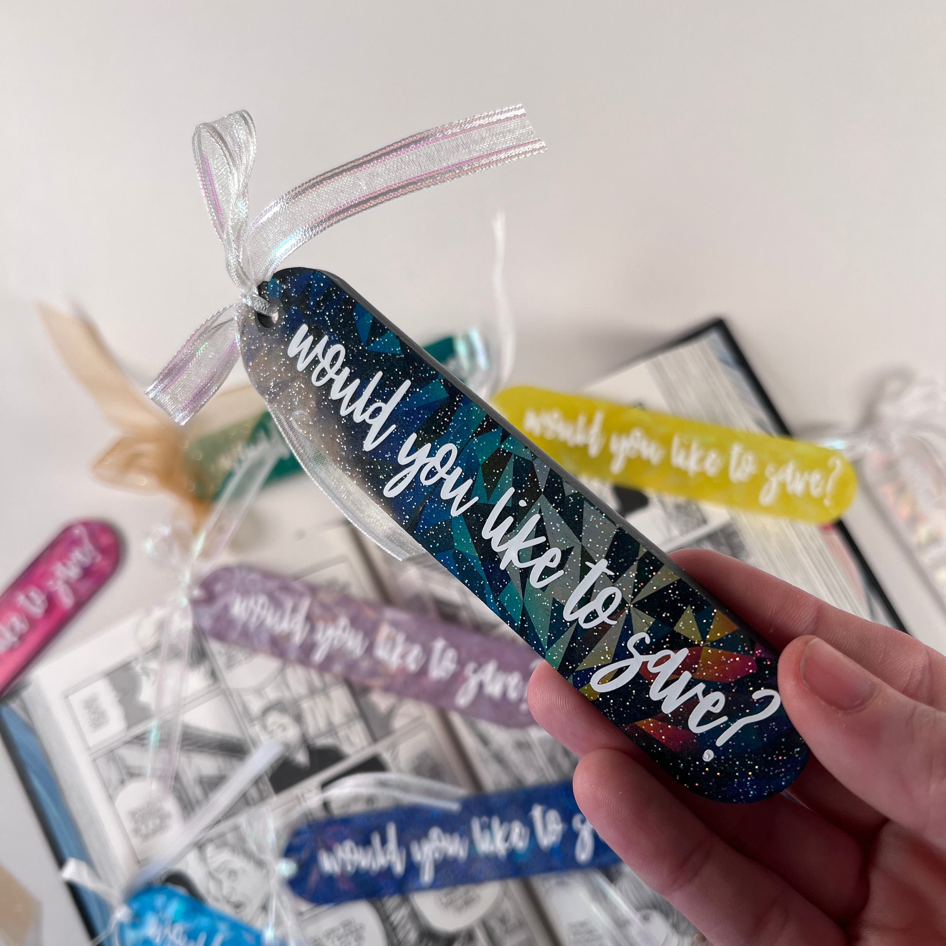 Handmade resin bookmark for gamers featuring 'Would you like to save?' design, vibrant colors, and glittery details. Perfect gift for RPG fans.