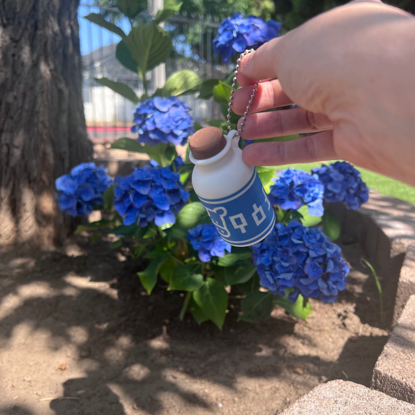 A cute Lon Lon Milk Bottle clicker toy inspired by classic games. 3D printed and handheld, great for fidgeting, gifting, or gamer-themed keychains.