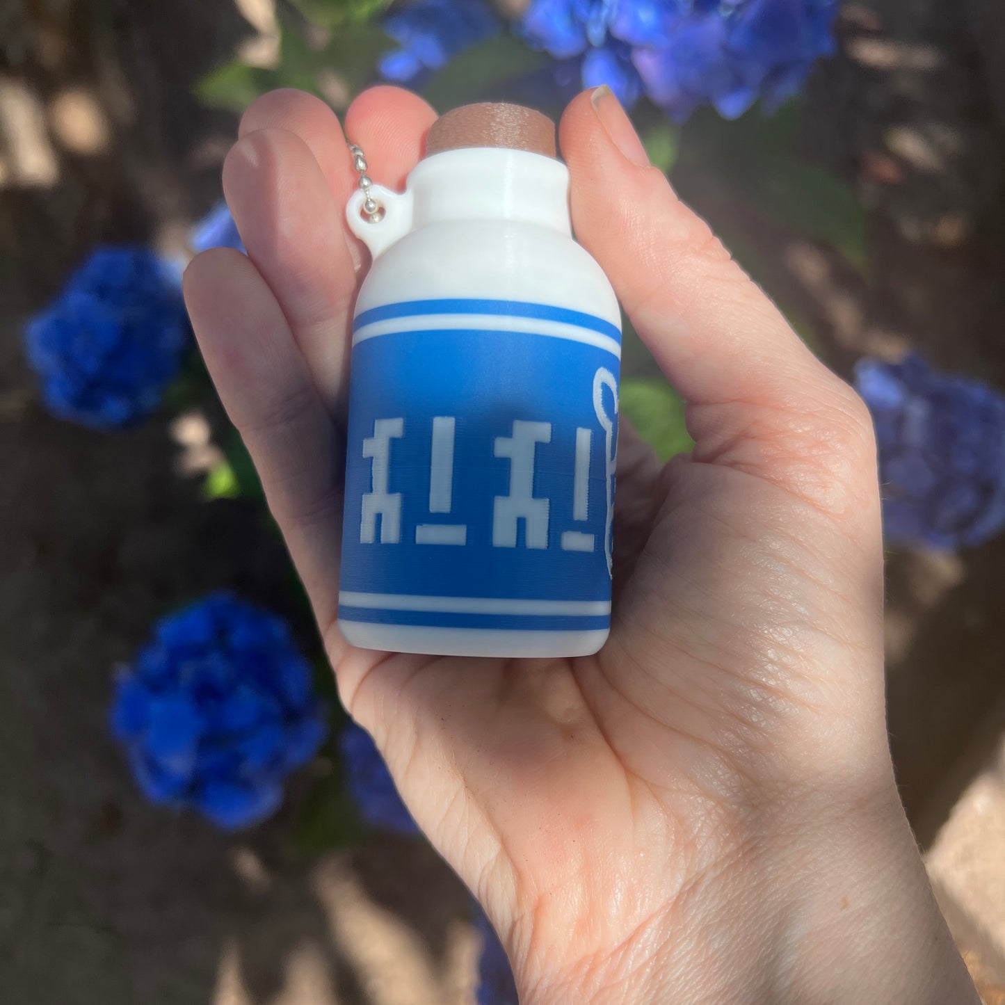 A cute Lon Lon Milk Bottle clicker toy inspired by classic games. 3D printed and handheld, great for fidgeting, gifting, or gamer-themed keychains.
