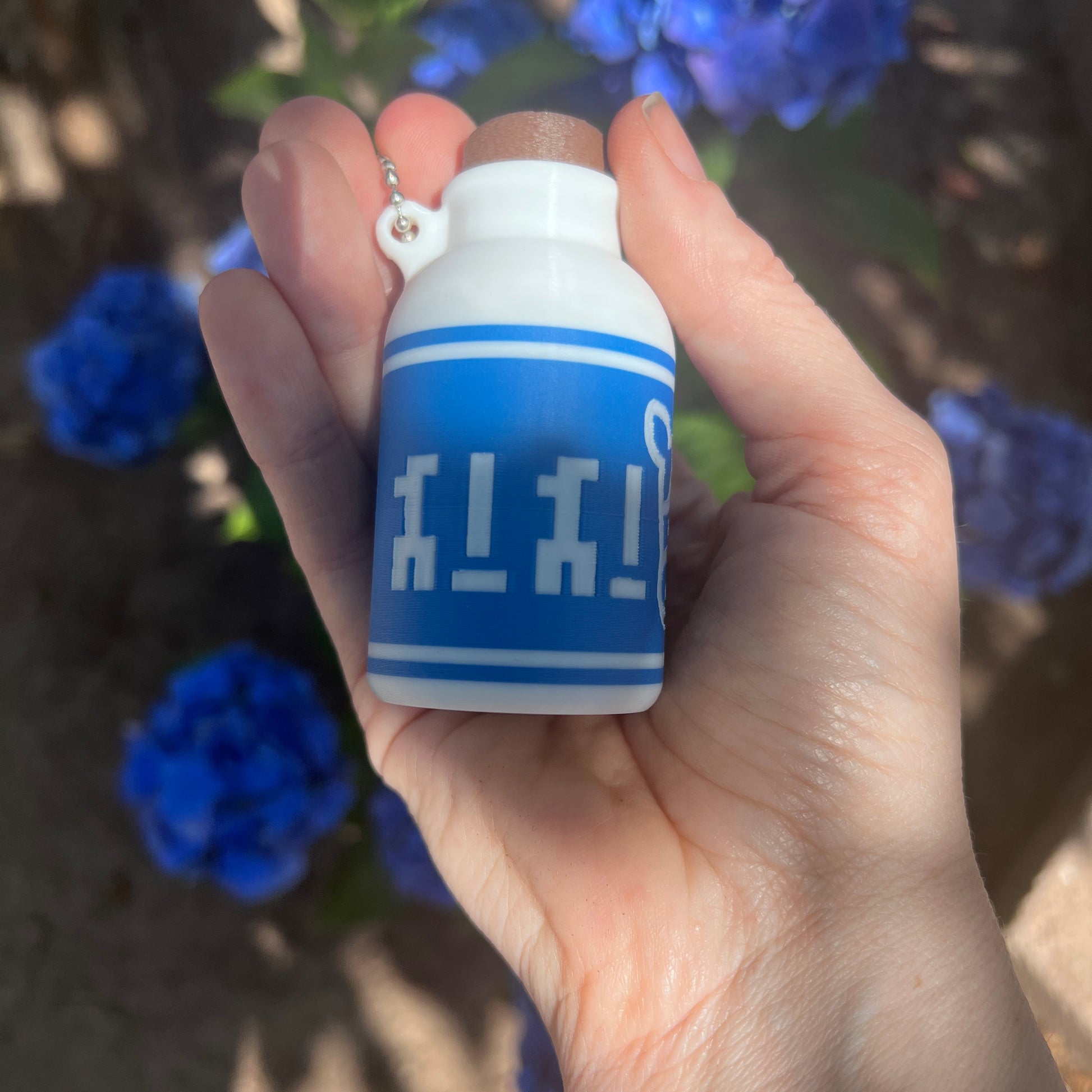 A cute Lon Lon Milk Bottle clicker toy inspired by classic games. 3D printed and handheld, great for fidgeting, gifting, or gamer-themed keychains.