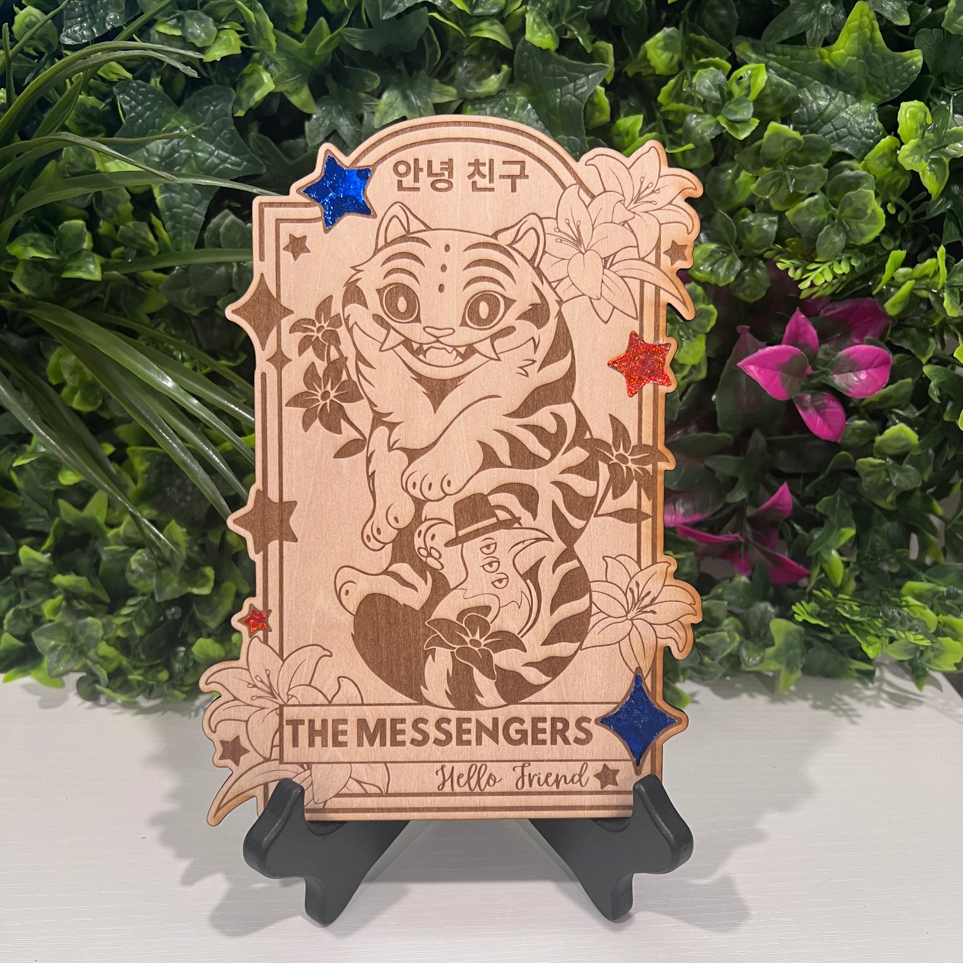 Wooden tarot card with blue and orange foil accents engraved with Derpy Tiger as The Messengers from KPOP Demon Hunters. Whimsical design with a magical, mystical twist.