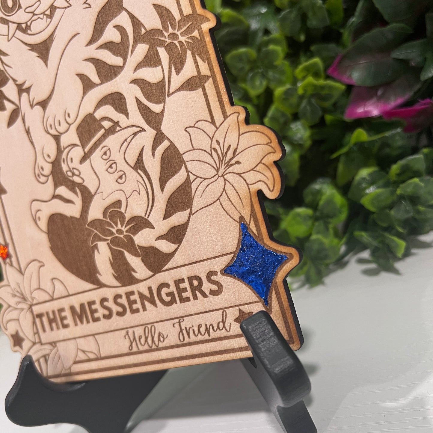 Wooden tarot card with blue and orange foil accents engraved with Derpy Tiger as The Messengers from KPOP Demon Hunters. Whimsical design with a magical, mystical twist.