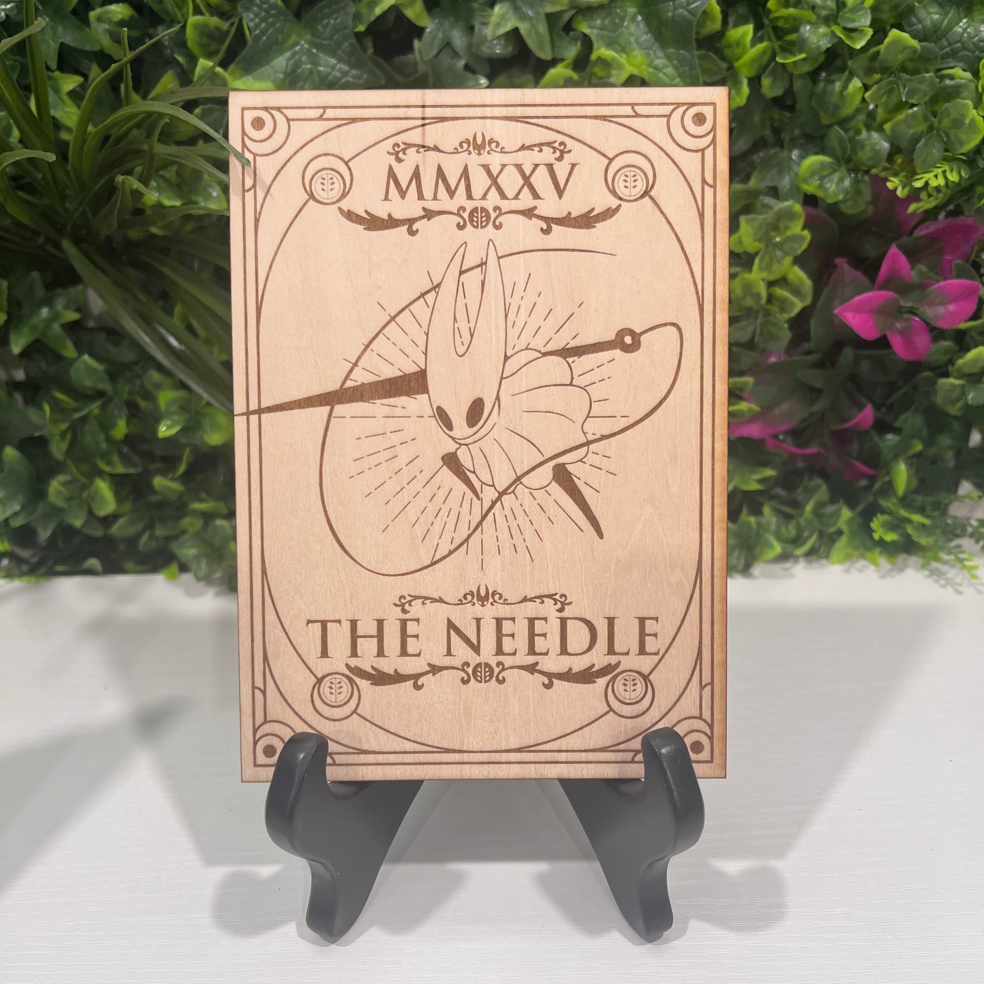 Set of two laser engraved wood tarot cards featuring Hollow Knight as The Nail and Hornet as the Needle. Unique indie game fan art collectible.