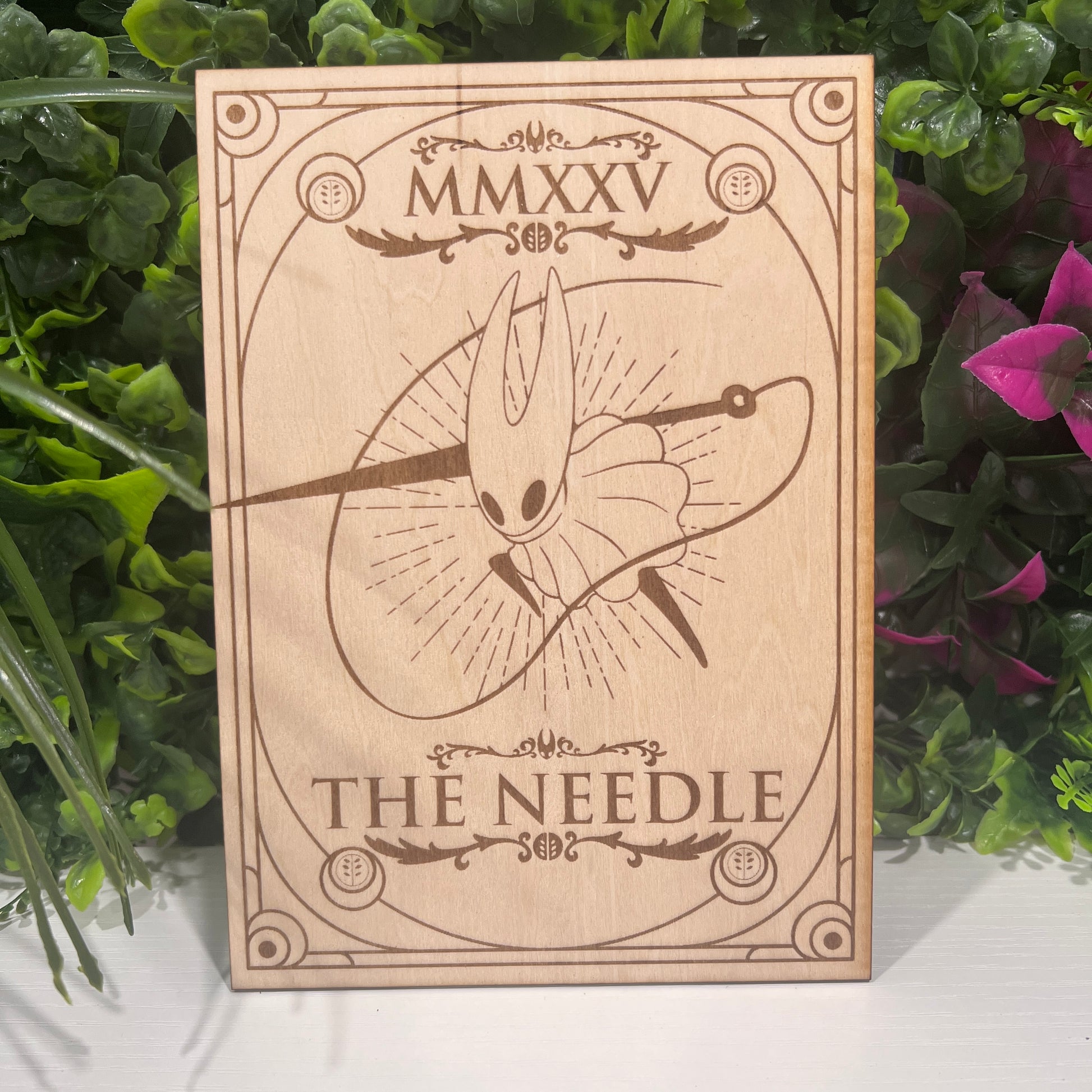 Set of two laser engraved wood tarot cards featuring Hollow Knight as The Nail and Hornet as the Needle. Unique indie game fan art collectible.