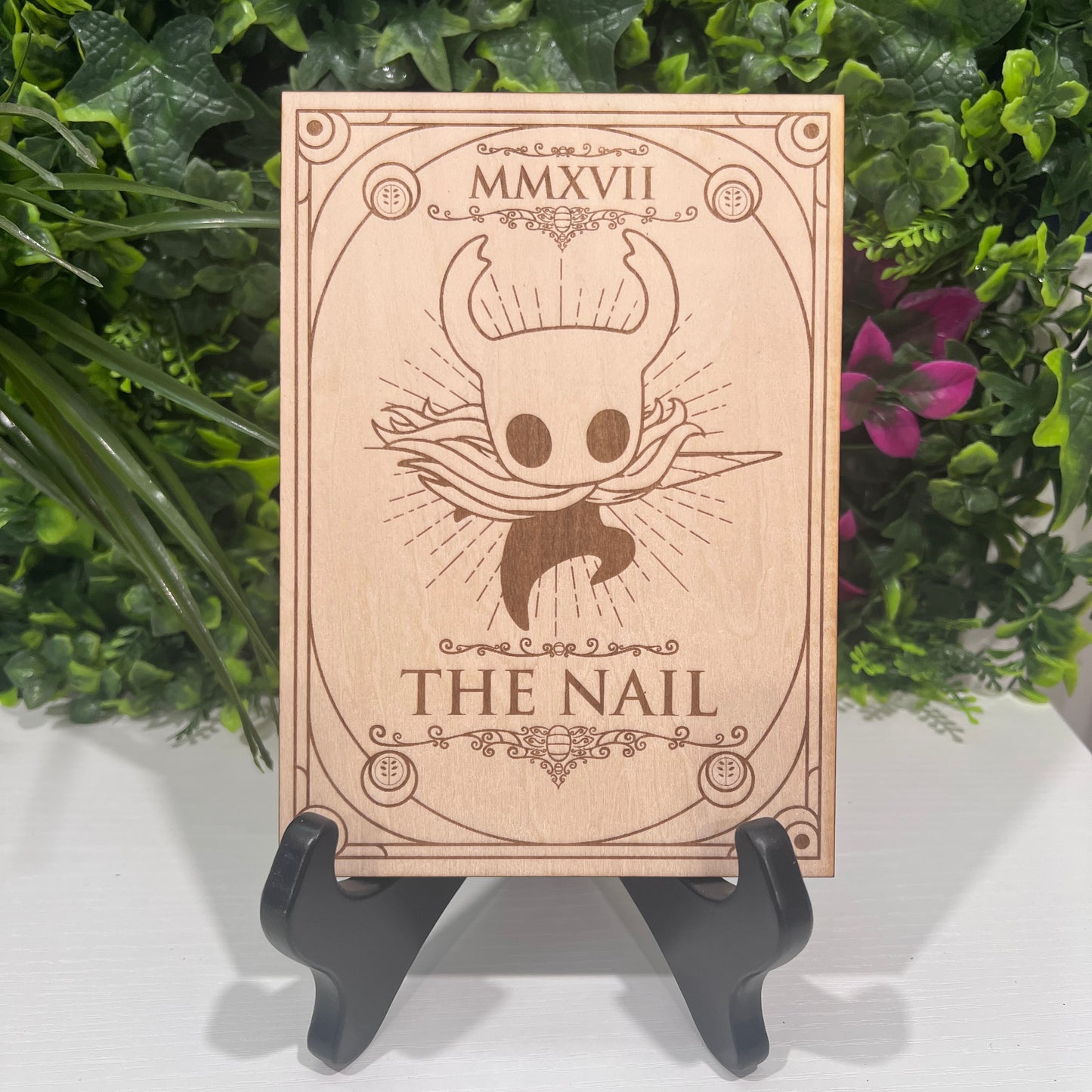 Set of two laser engraved wood tarot cards featuring Hollow Knight as The Nail and Hornet as the Needle. Unique indie game fan art collectible.
