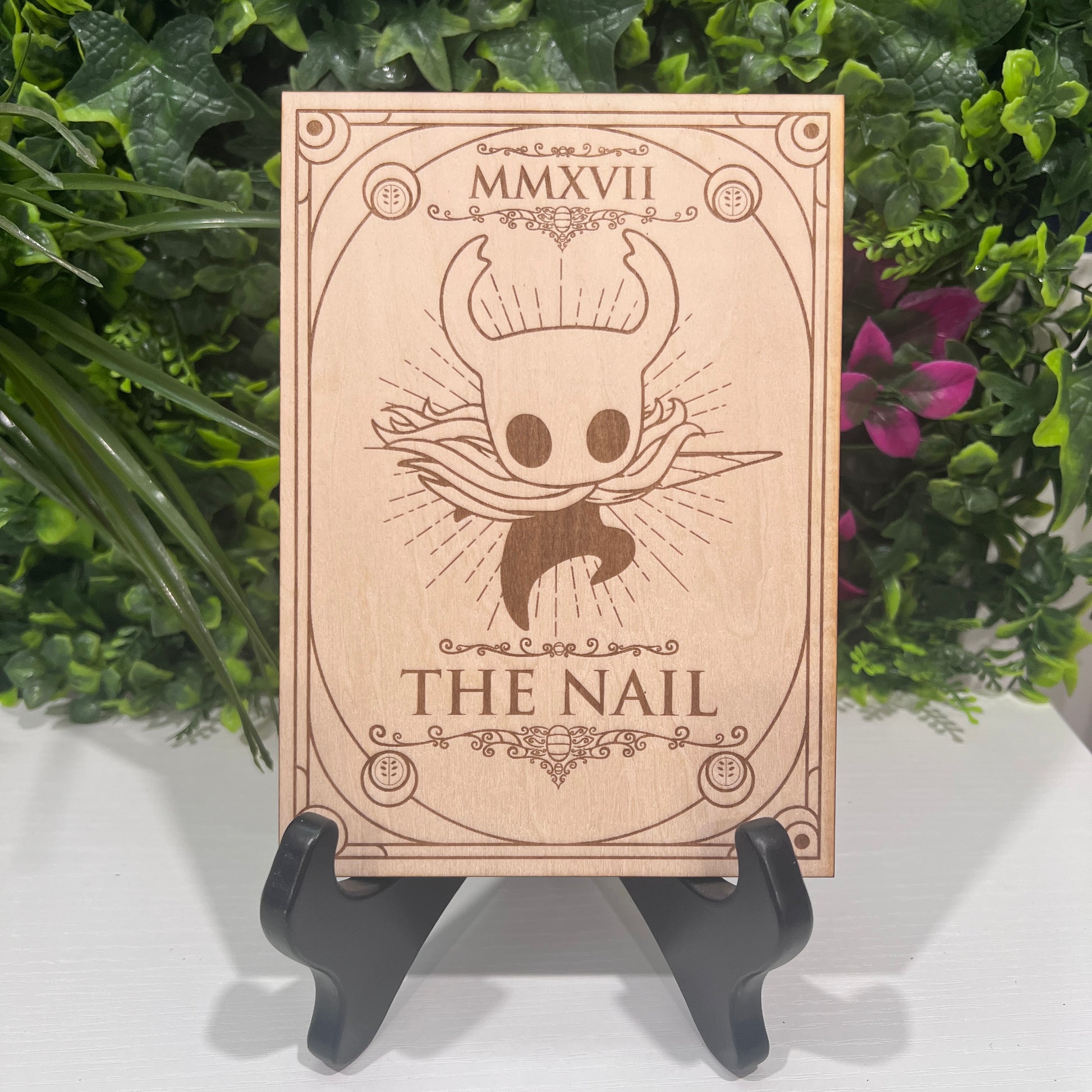 Set of two laser engraved wood tarot cards featuring Hollow Knight as The Nail and Hornet as the Needle. Unique indie game fan art collectible.