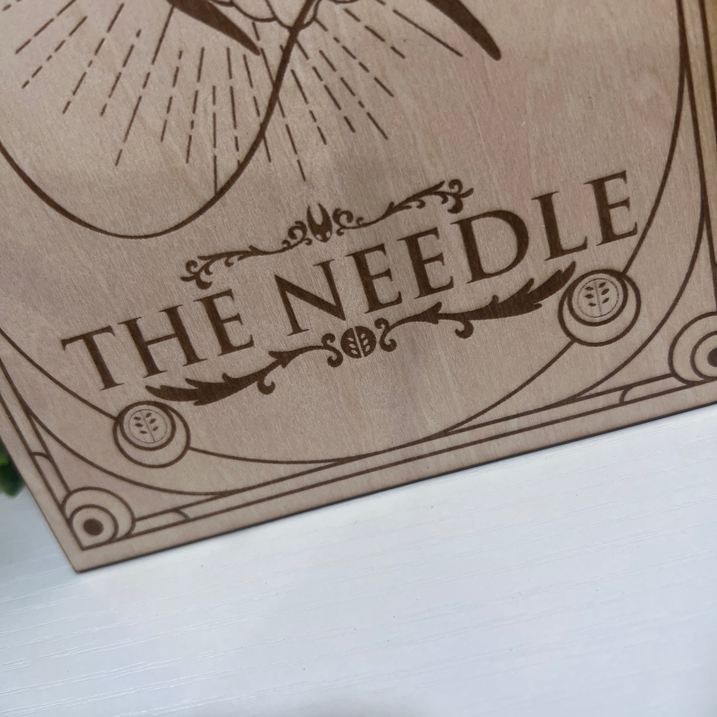 Set of two laser engraved wood tarot cards featuring Hollow Knight as The Nail and Hornet as the Needle. Unique indie game fan art collectible.