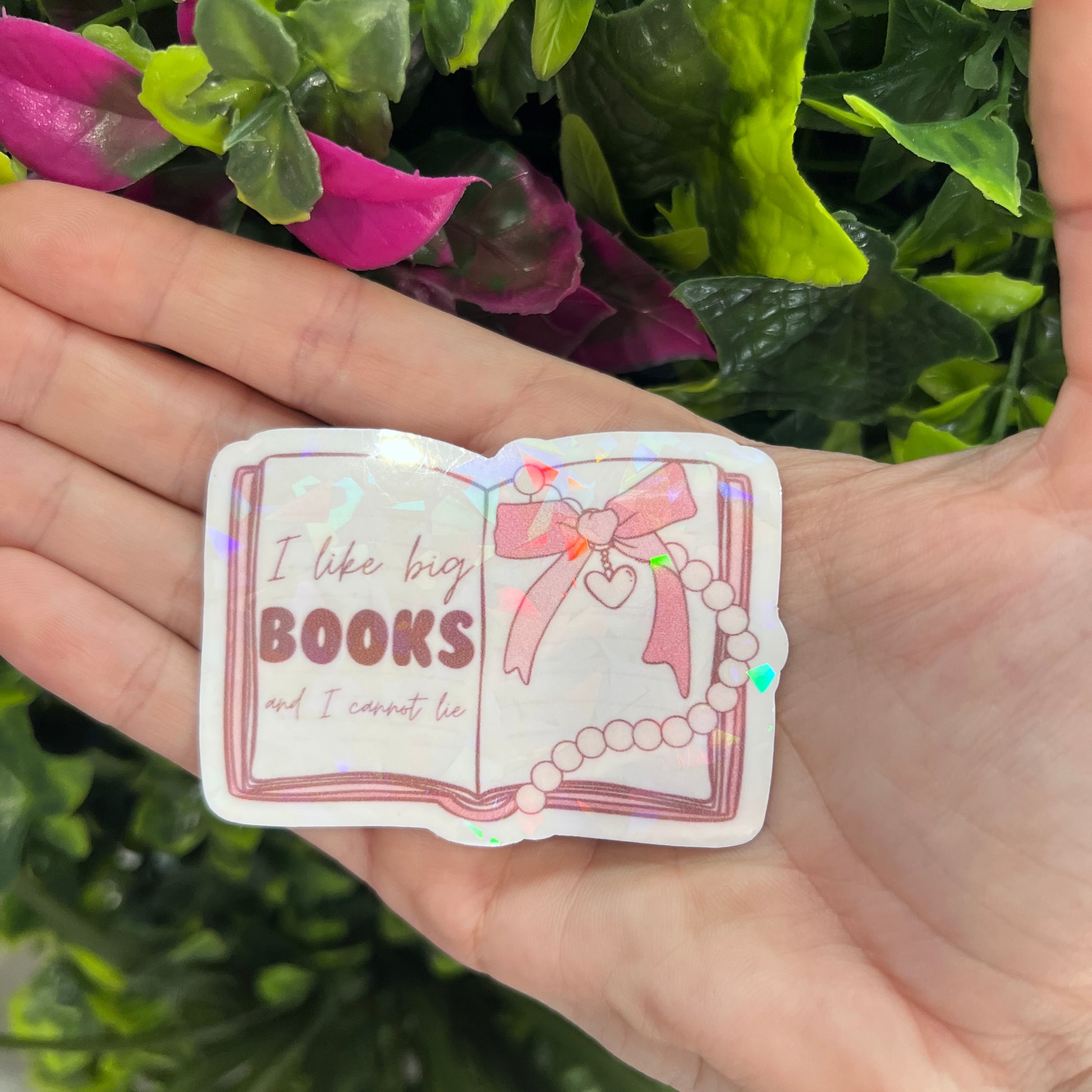 Holographic vinyl sticker with the phrase "I like big books and I cannot lie." Perfect for book lovers, readers, and bookish gifts.