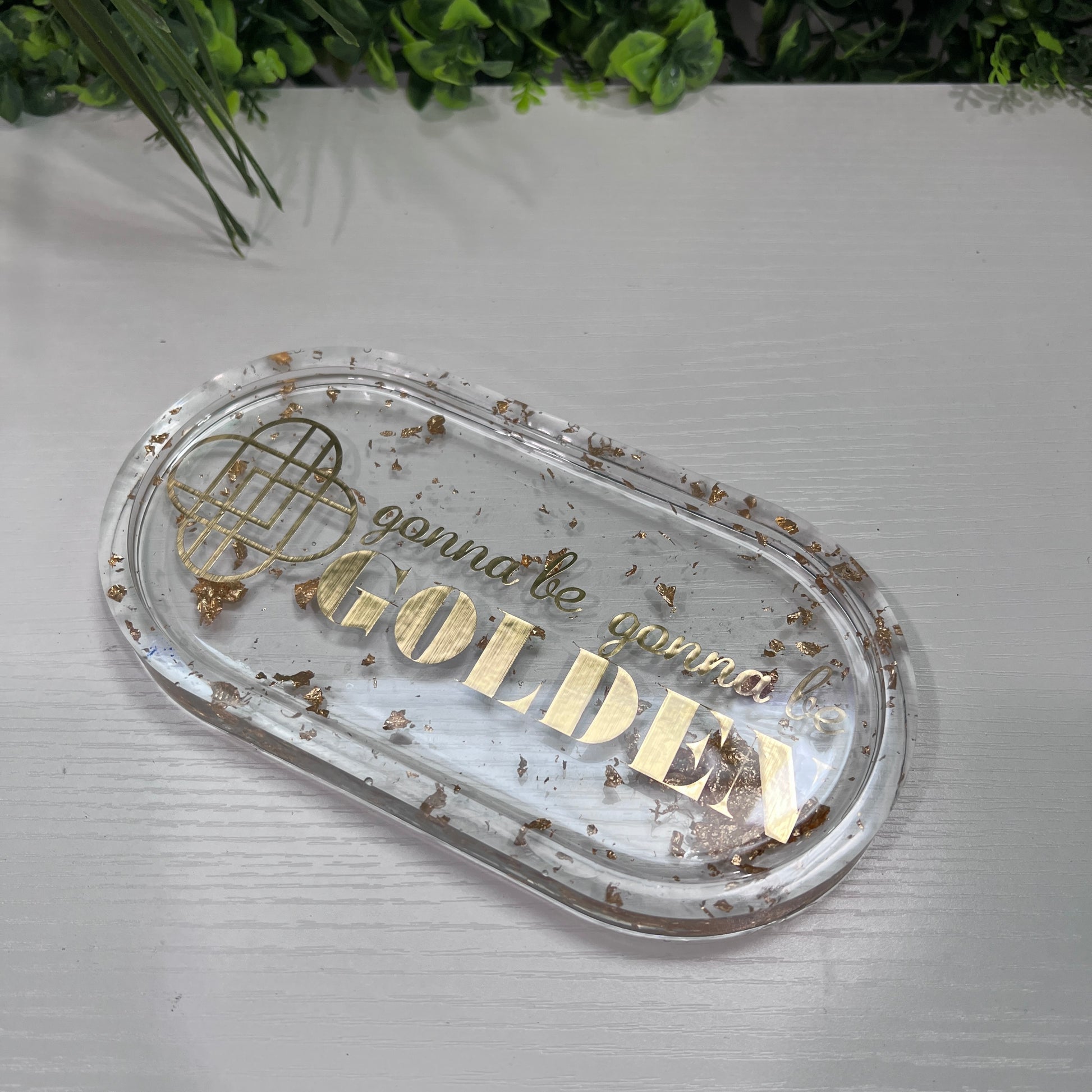 Handmade resin trinket tray with gold leaf and the quote “Gonna Be Gonna Be Golden.” Kpop Demon Hunters–inspired jewelry dish, perfect for gifts or décor.
