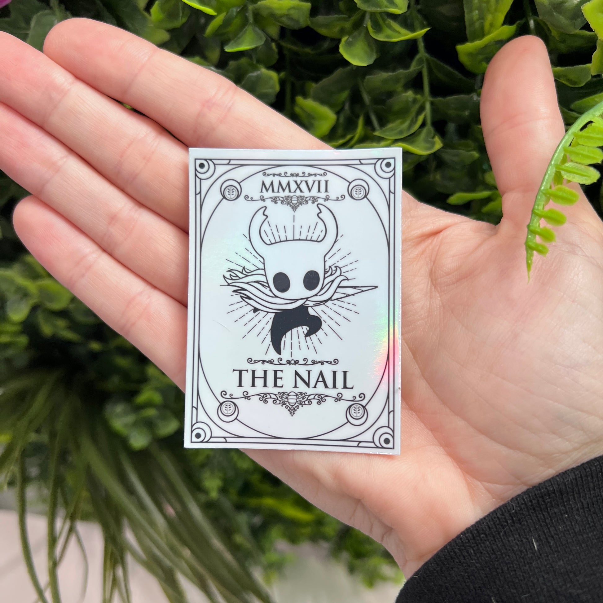 Silver Holographic tarot card stickers featuring Hollow Knight as The Nail and Hornet as the Needle. Unique indie game fan art collectible.