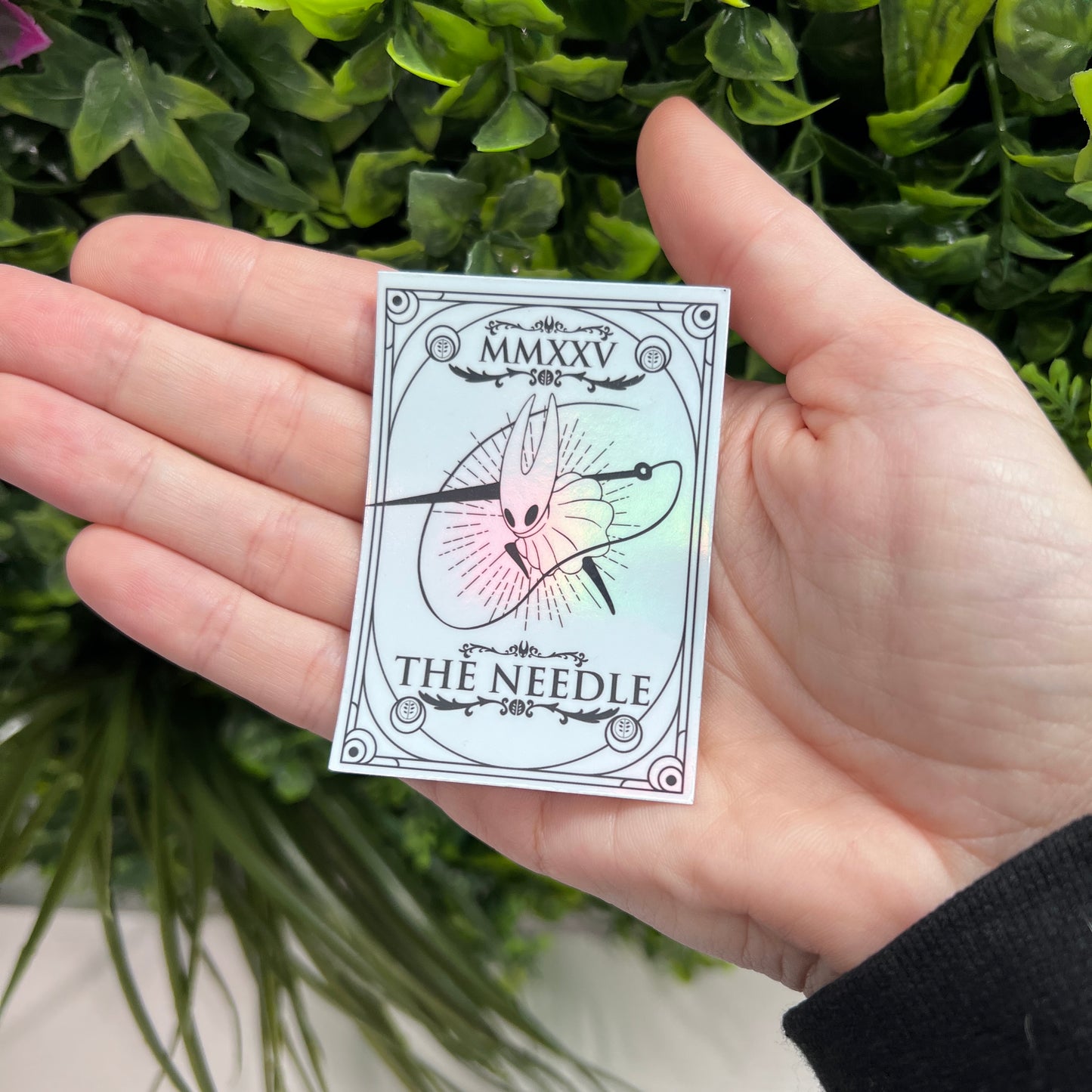 Silver Holographic tarot card stickers featuring Hollow Knight as The Nail and Hornet as the Needle. Unique indie game fan art collectible.