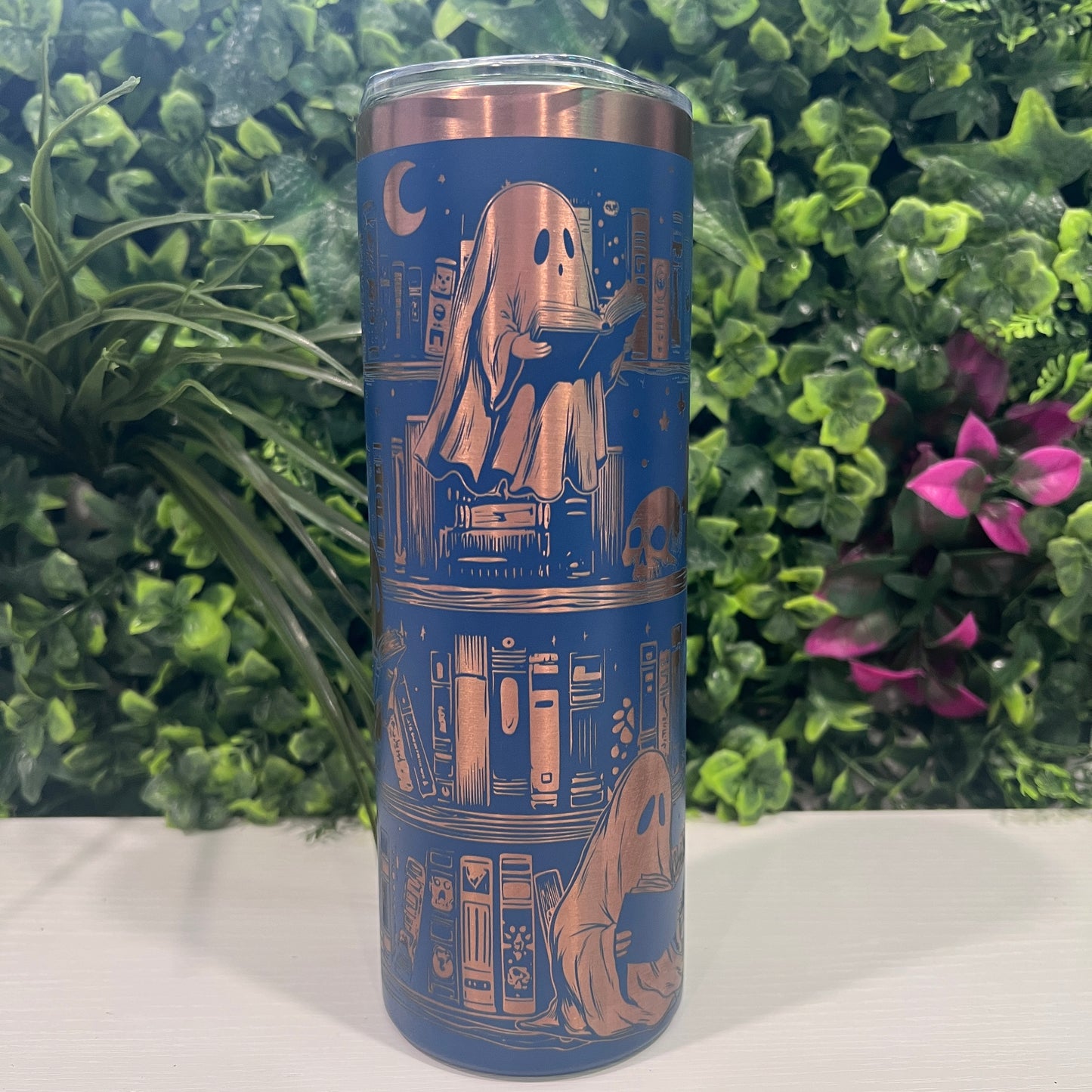 20oz laser engraved skinny tumbler featuring Halloween books, ghosts, bats, and spiderwebs. Perfect spooky drinkware for witchy book lovers and gothic décor fans.