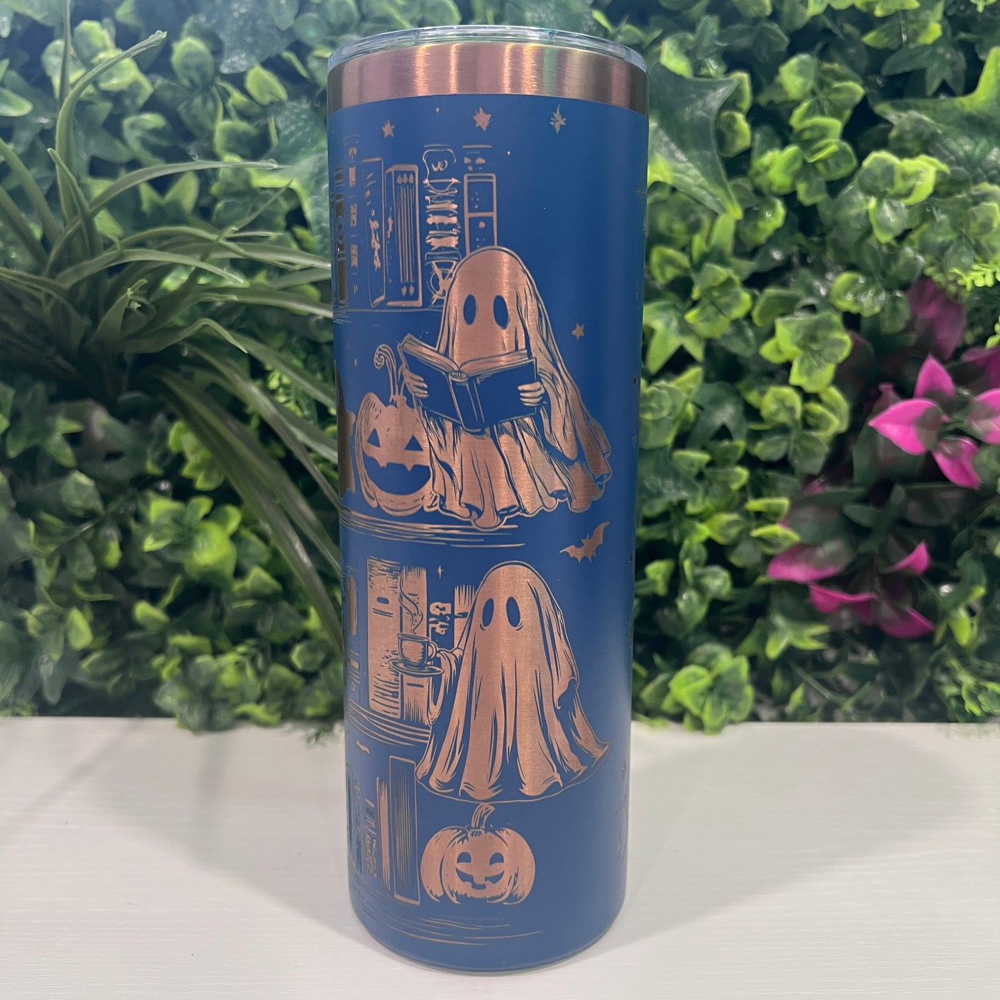 20oz laser engraved skinny tumbler featuring Halloween books, ghosts, bats, and spiderwebs. Perfect spooky drinkware for witchy book lovers and gothic décor fans.