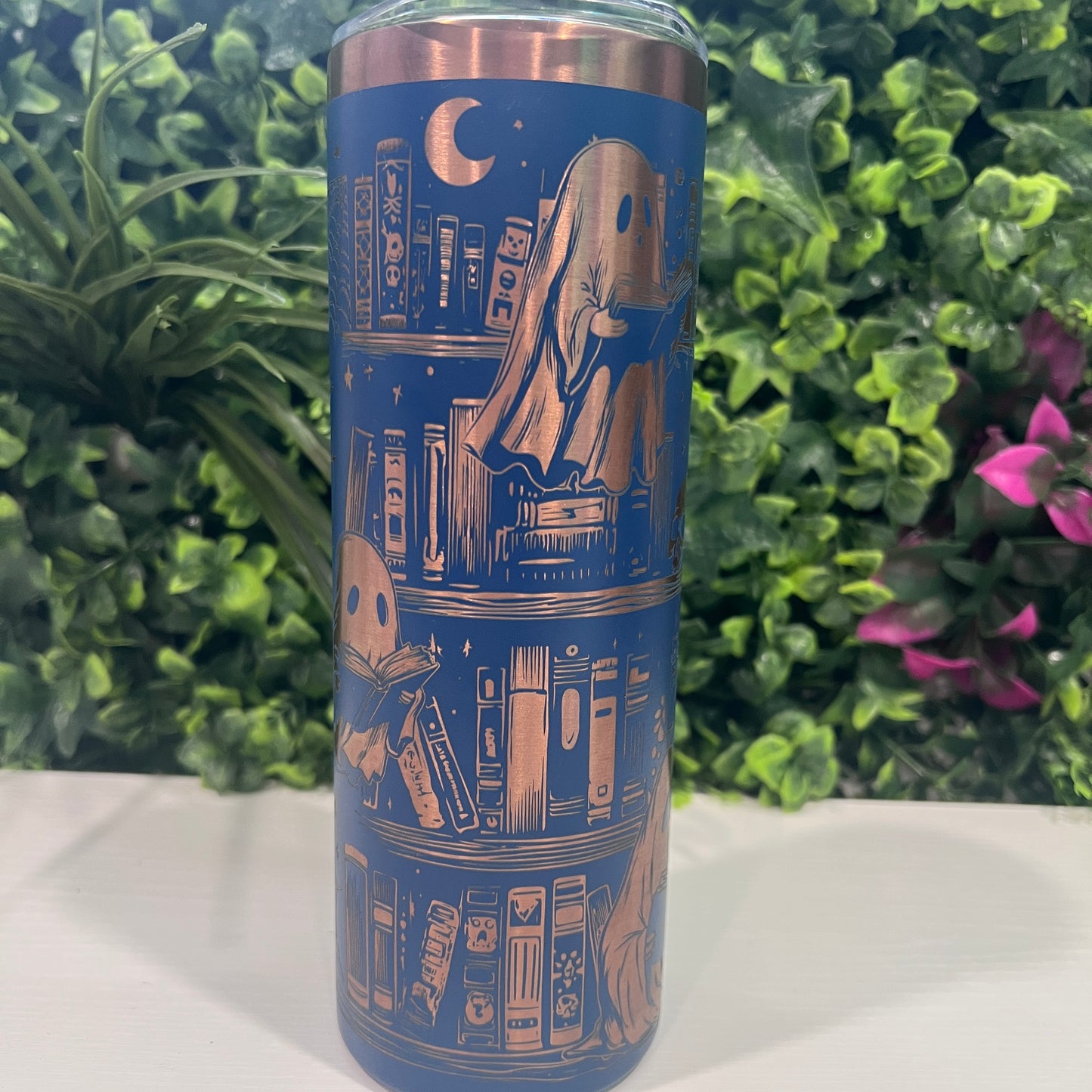20oz laser engraved skinny tumbler featuring Halloween books, ghosts, bats, and spiderwebs. Perfect spooky drinkware for witchy book lovers and gothic décor fans.