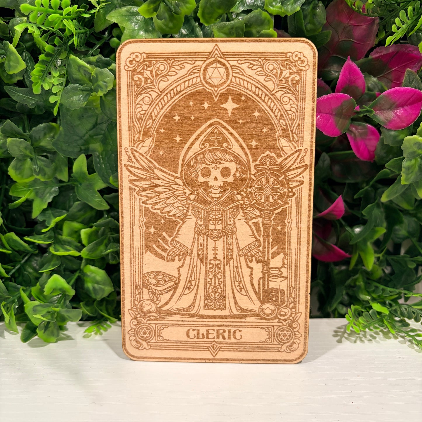 Laser engraved 3mm basswood tarot cards featuring a Cleric class design. Intricate fantasy artwork with dice, magic symbols, and ornate gothic detailing.