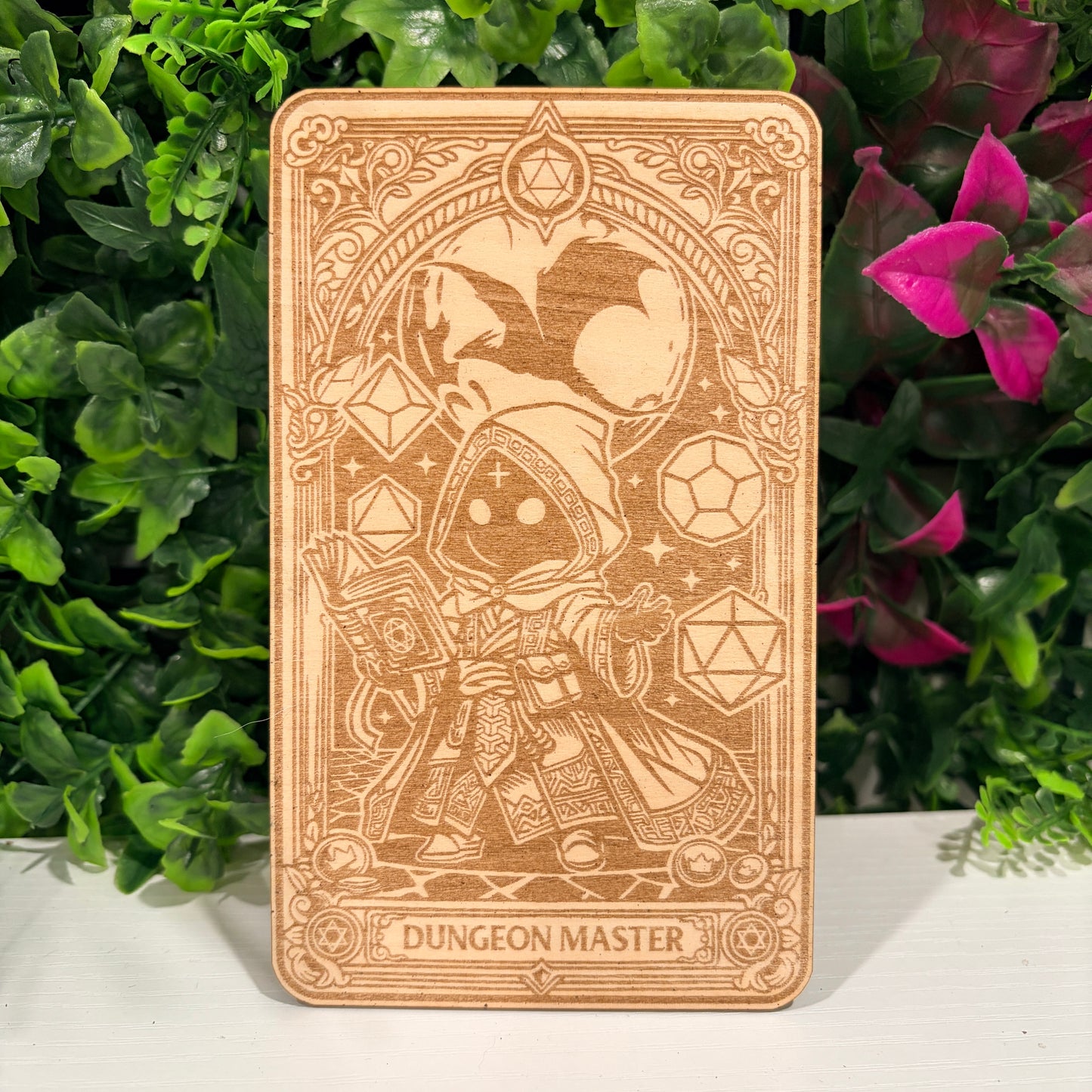 Laser engraved 3mm basswood tarot cards featuring a Dungeon Master class design from Dungeons and Dragons. Intricate fantasy artwork with dice, magic symbols, and ornate gothic detailing.