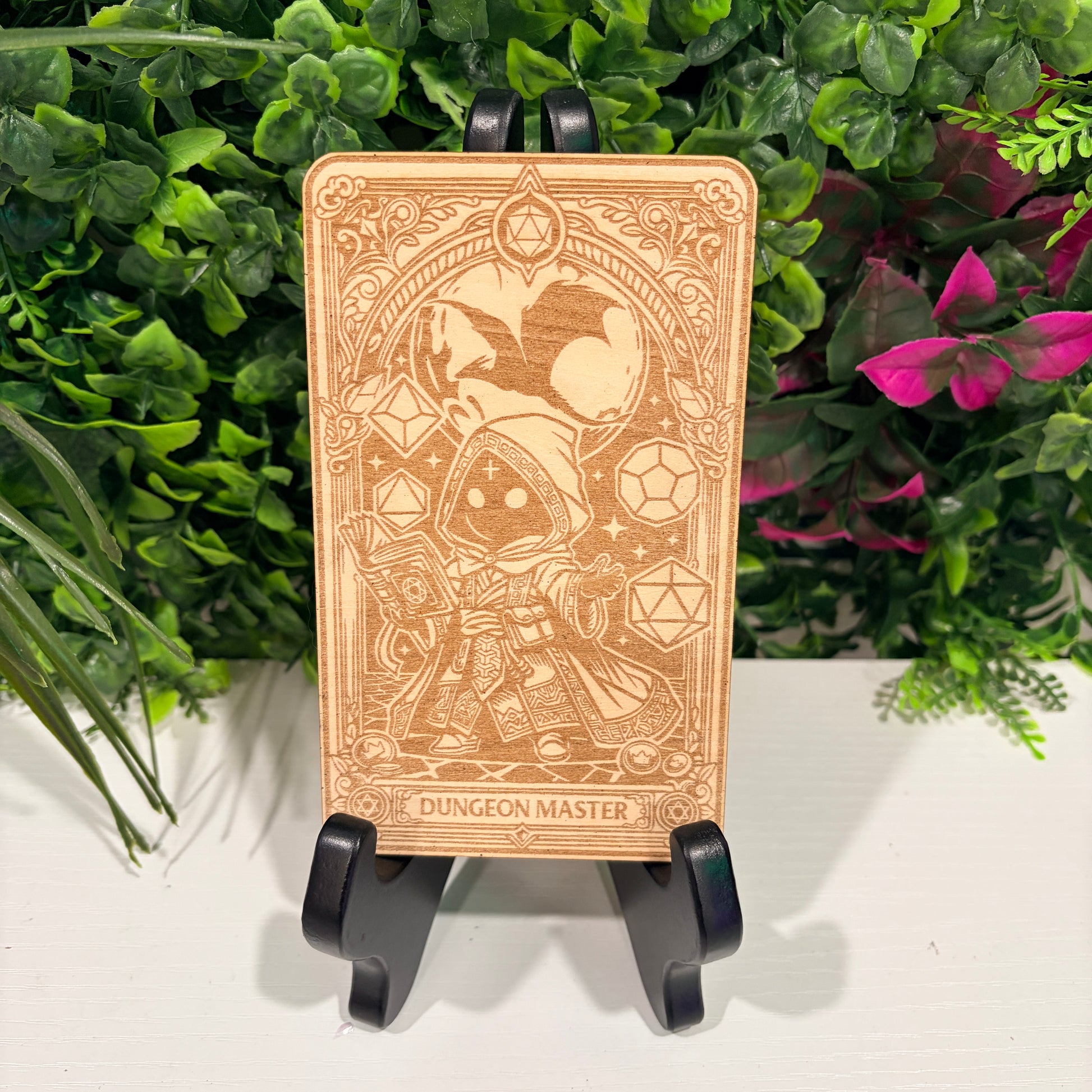 Laser engraved 3mm basswood tarot cards featuring a Dungeon Master class design from Dungeons and Dragons. Intricate fantasy artwork with dice, magic symbols, and ornate gothic detailing.