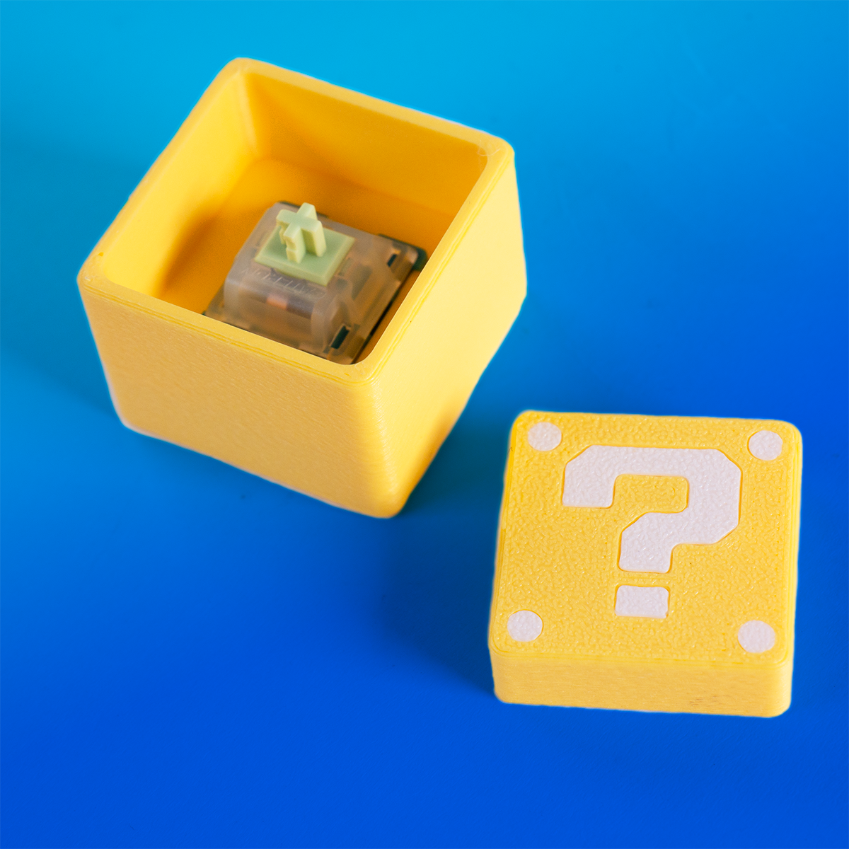 Super Mario-inspired question block fidget clicker, perfect for gamers. Handheld stress relief toy with satisfying click action. Ideal gift for Nintendo fans and retro gaming lovers.