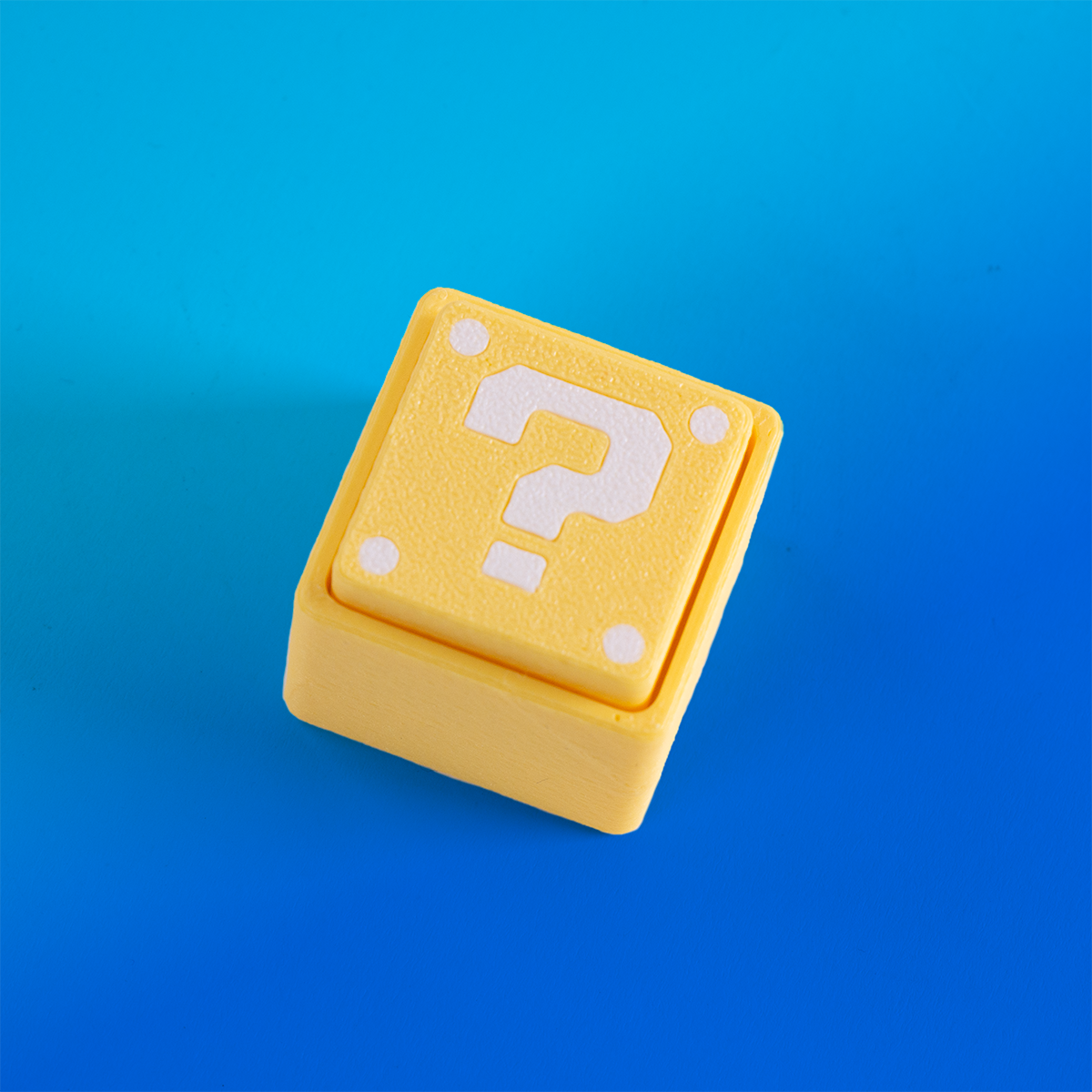 Super Mario-inspired question block fidget clicker, perfect for gamers. Handheld stress relief toy with satisfying click action. Ideal gift for Nintendo fans and retro gaming lovers.