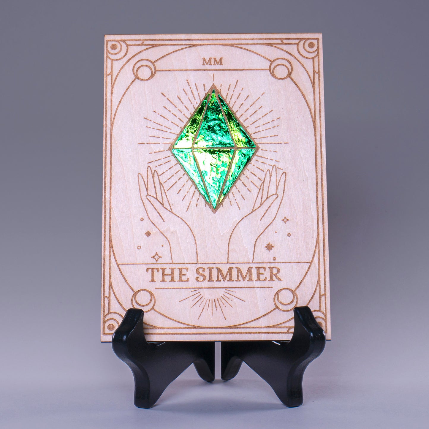 Laser-engraved wooden tarot card featuring "The Simmer" with a radiant foiled plumbob design. A must-have for Sims fans, gamers, and lovers of geeky decor.