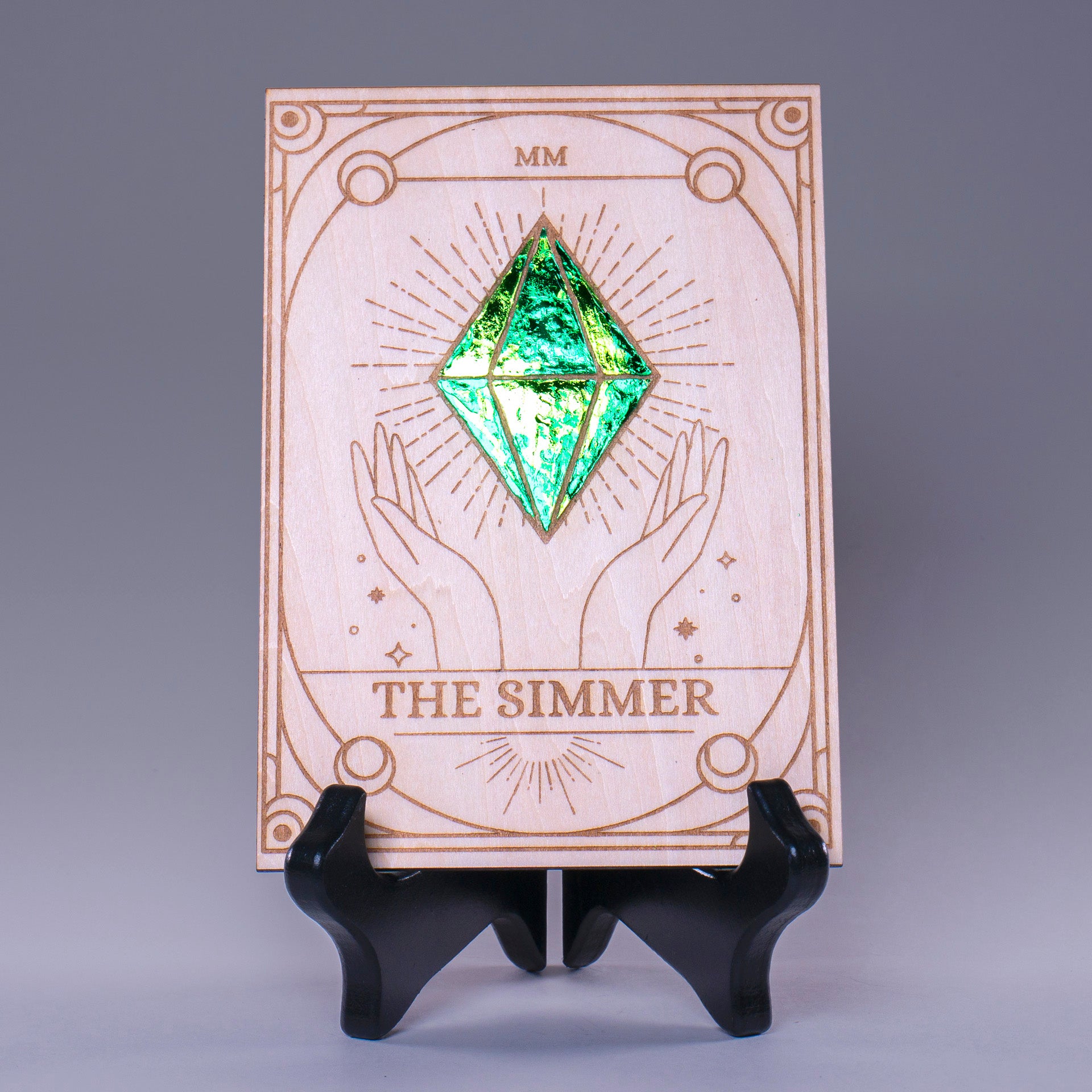 Laser-engraved wooden tarot card featuring "The Simmer" with a radiant foiled plumbob design. A must-have for Sims fans, gamers, and lovers of geeky decor.