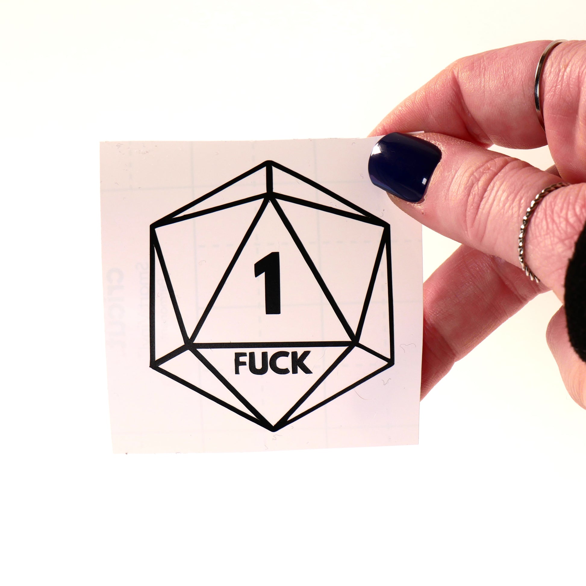Hilarious D20 vinyl sticker featuring a Nat 1 critical fail with "1 FUCK" text. Perfect for DND players, dungeon masters, and tabletop RPG lovers.