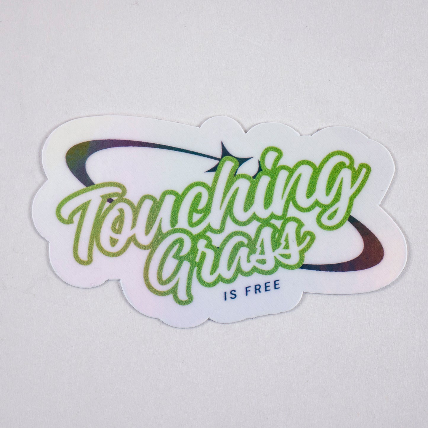 Retro vinyl sticker with “Touching Grass is Free” text in green and black, perfect for laptops, water bottles, or gamer aesthetics.