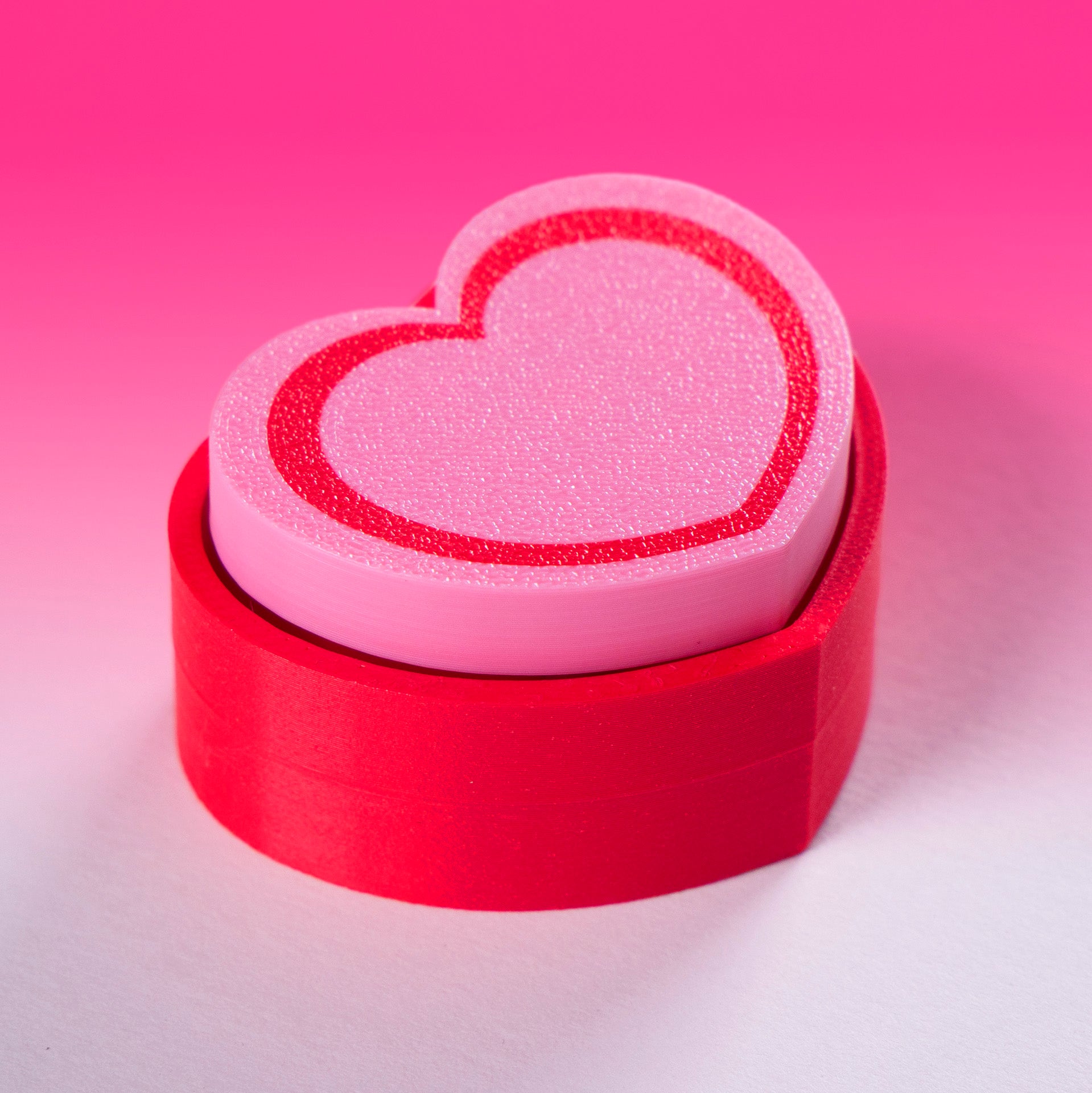 Cute 3D printed heart button clicker in red, perfect for fidgeting, gamer desks, Valentine's gifts, or spreading some love with every satisfying click.