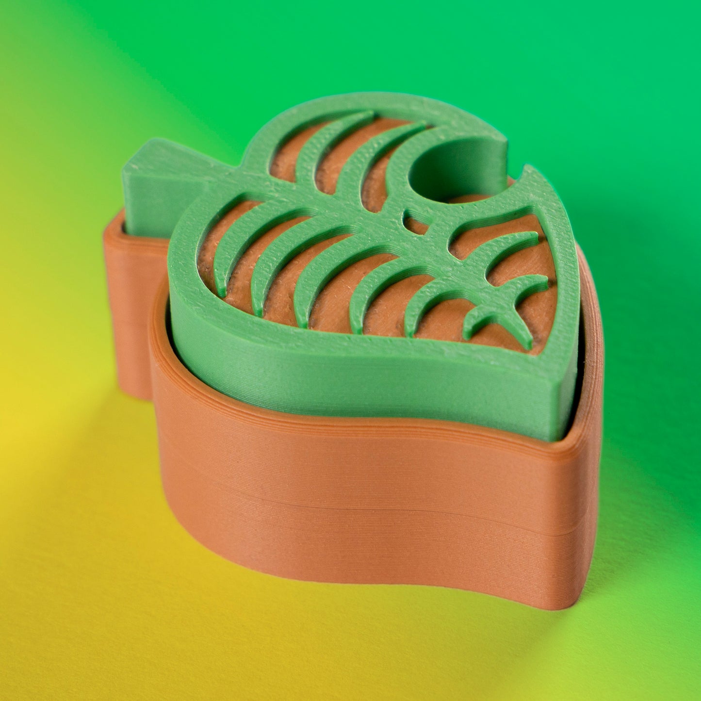 Cute green Animal Crossing leaf-shaped fidget clicker, perfect for gamers and Nintendo fans. Handheld stress relief toy with satisfying click action.