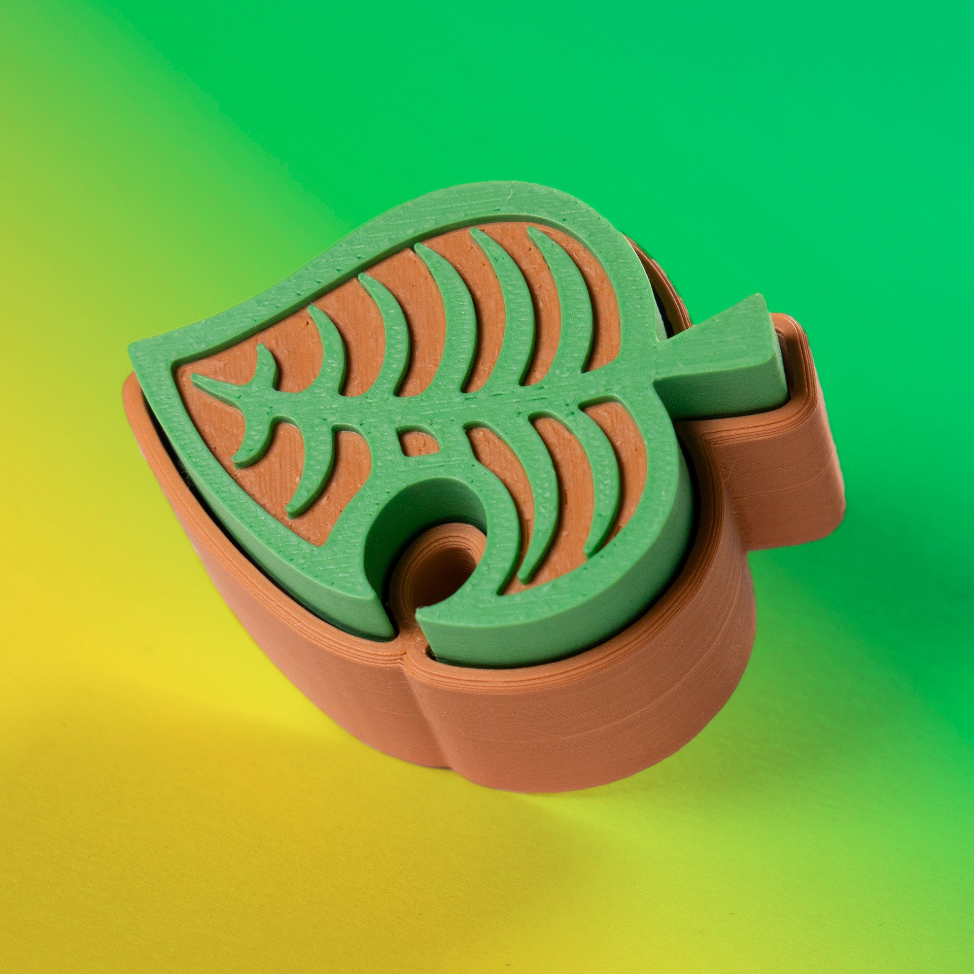 Cute green Animal Crossing leaf-shaped fidget clicker, perfect for gamers and Nintendo fans. Handheld stress relief toy with satisfying click action.