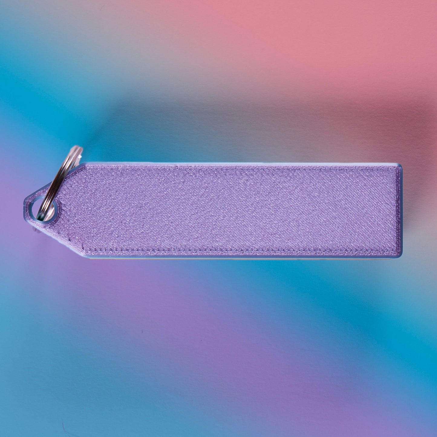 Rainbow 4-key mechanical clicker with white keycaps and keychain loop, perfect for fidgeting, gamer desk setups, or stress relief on the go.