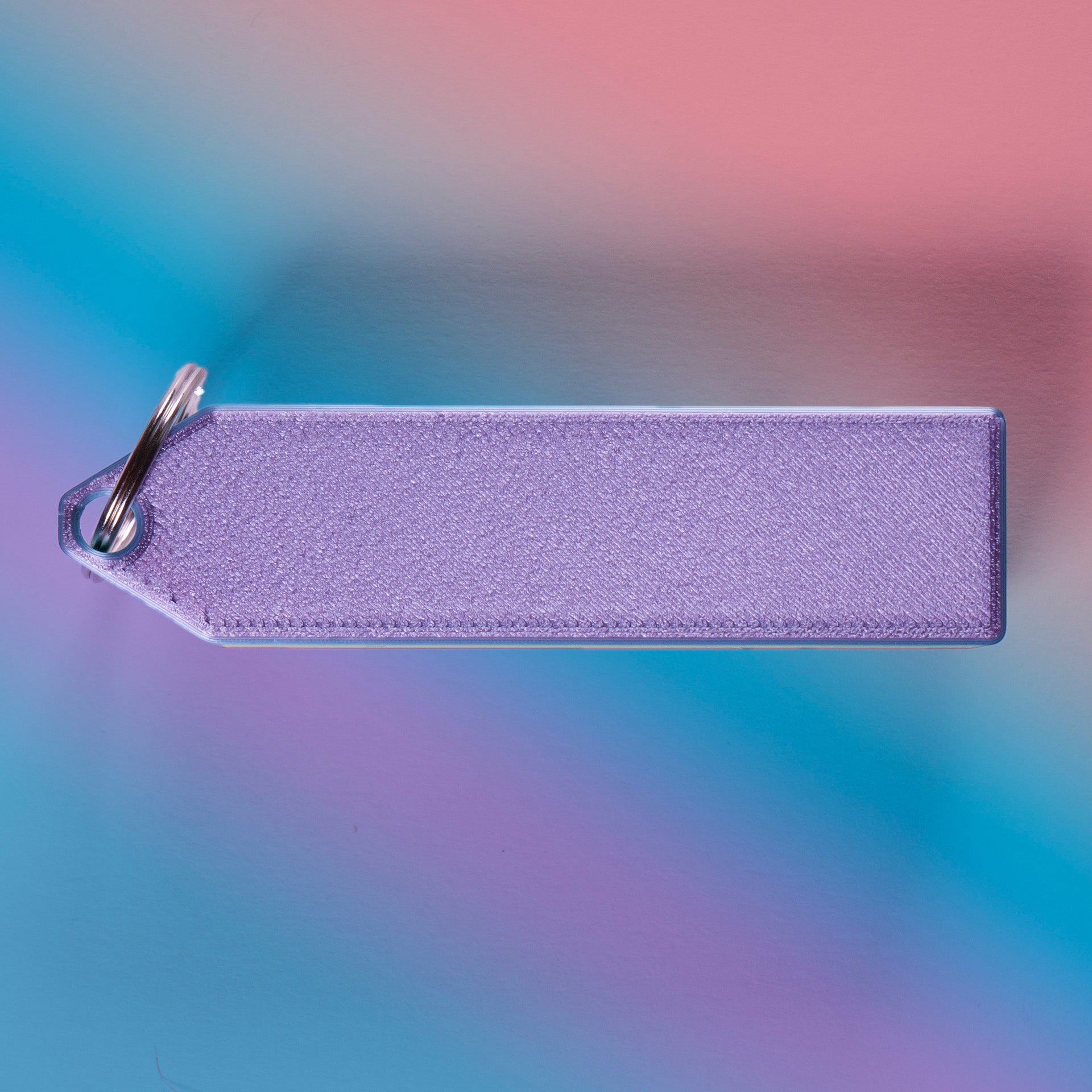 Rainbow 4-key mechanical clicker with white keycaps and keychain loop, perfect for fidgeting, gamer desk setups, or stress relief on the go.