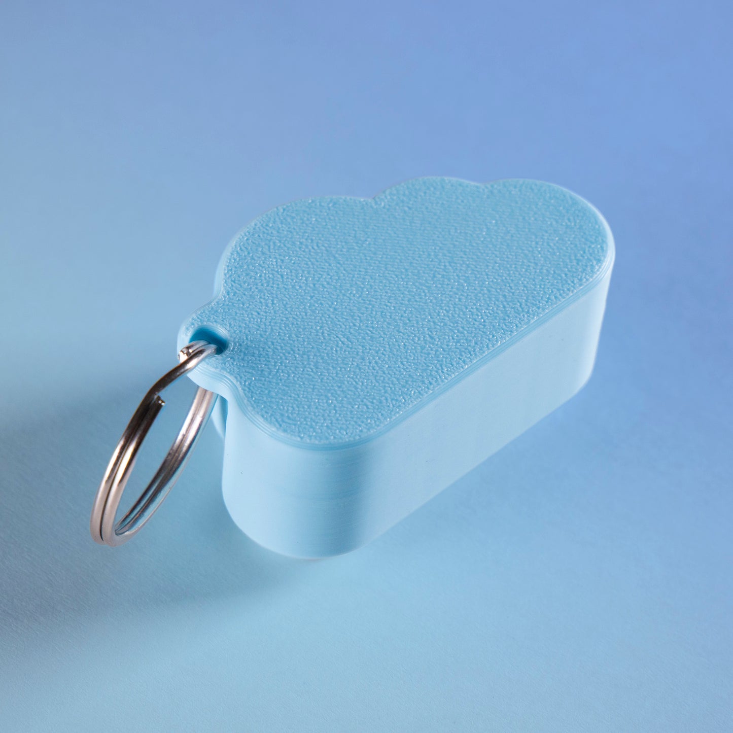 Kawaii cloud fidget clicker keychain with blushing cheeks and a smile, perfect for stress relief, gamer gifts, or cute everyday carry.