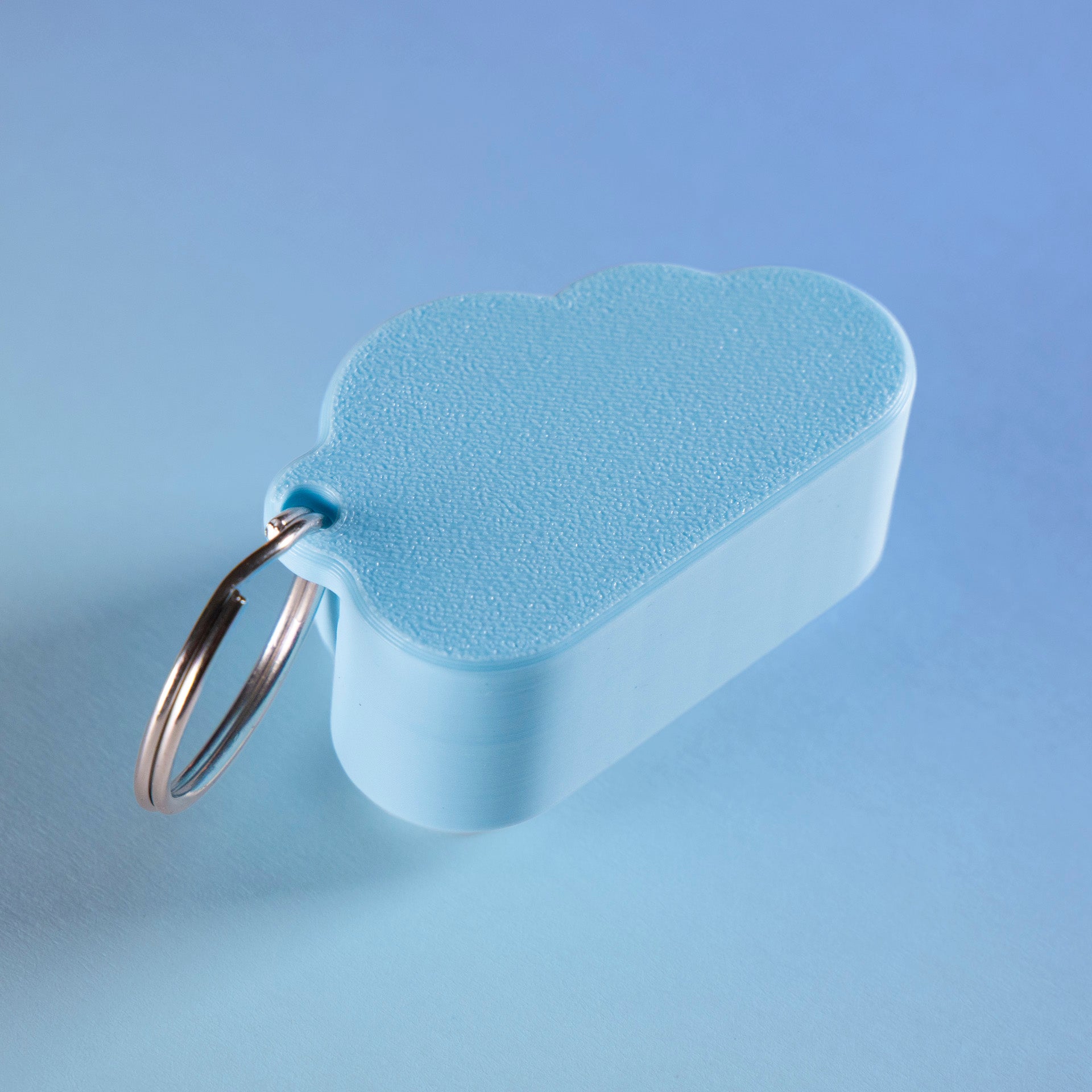 Kawaii cloud fidget clicker keychain with blushing cheeks and a smile, perfect for stress relief, gamer gifts, or cute everyday carry.