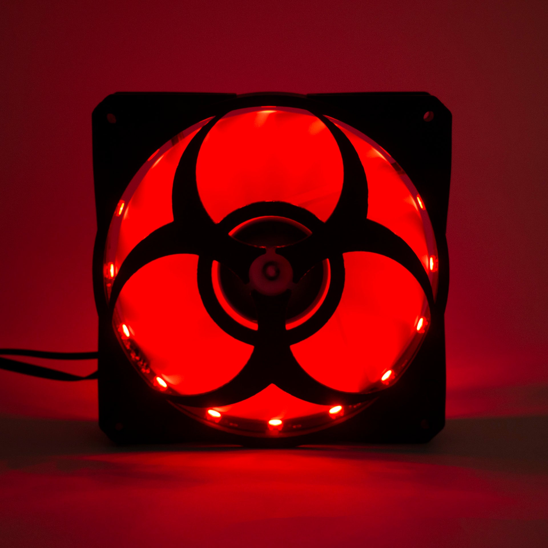 3D printed PC fan grill featuring a bold biohazard symbol. Perfect for custom gaming rigs, PC case mods, and fans of edgy, nerdy, or horror-inspired builds.
