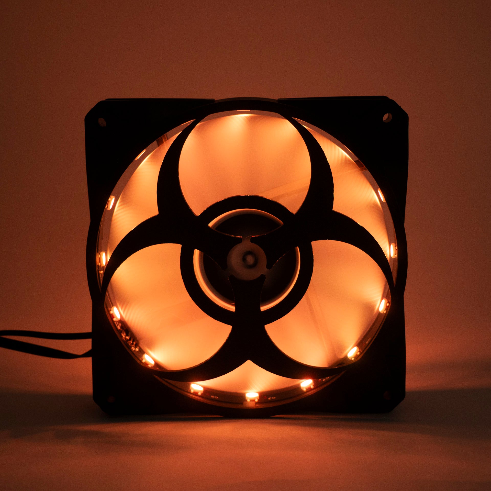 3D printed PC fan grill featuring a bold biohazard symbol. Perfect for custom gaming rigs, PC case mods, and fans of edgy, nerdy, or horror-inspired builds.