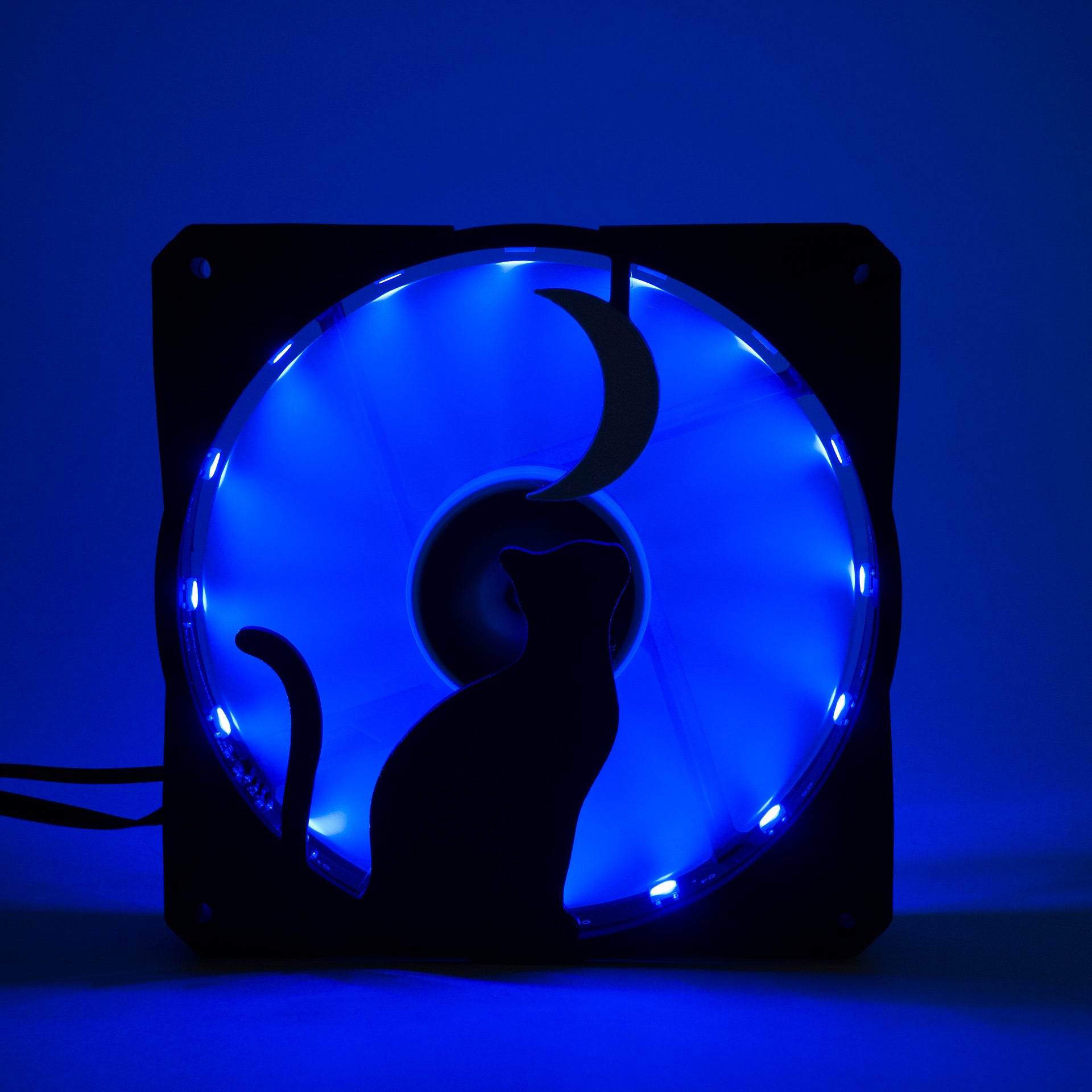 3D printed PC fan grill with a silhouette of a cat gazing at the moon. Perfect for whimsical gaming setups and cat lovers who love custom tech.