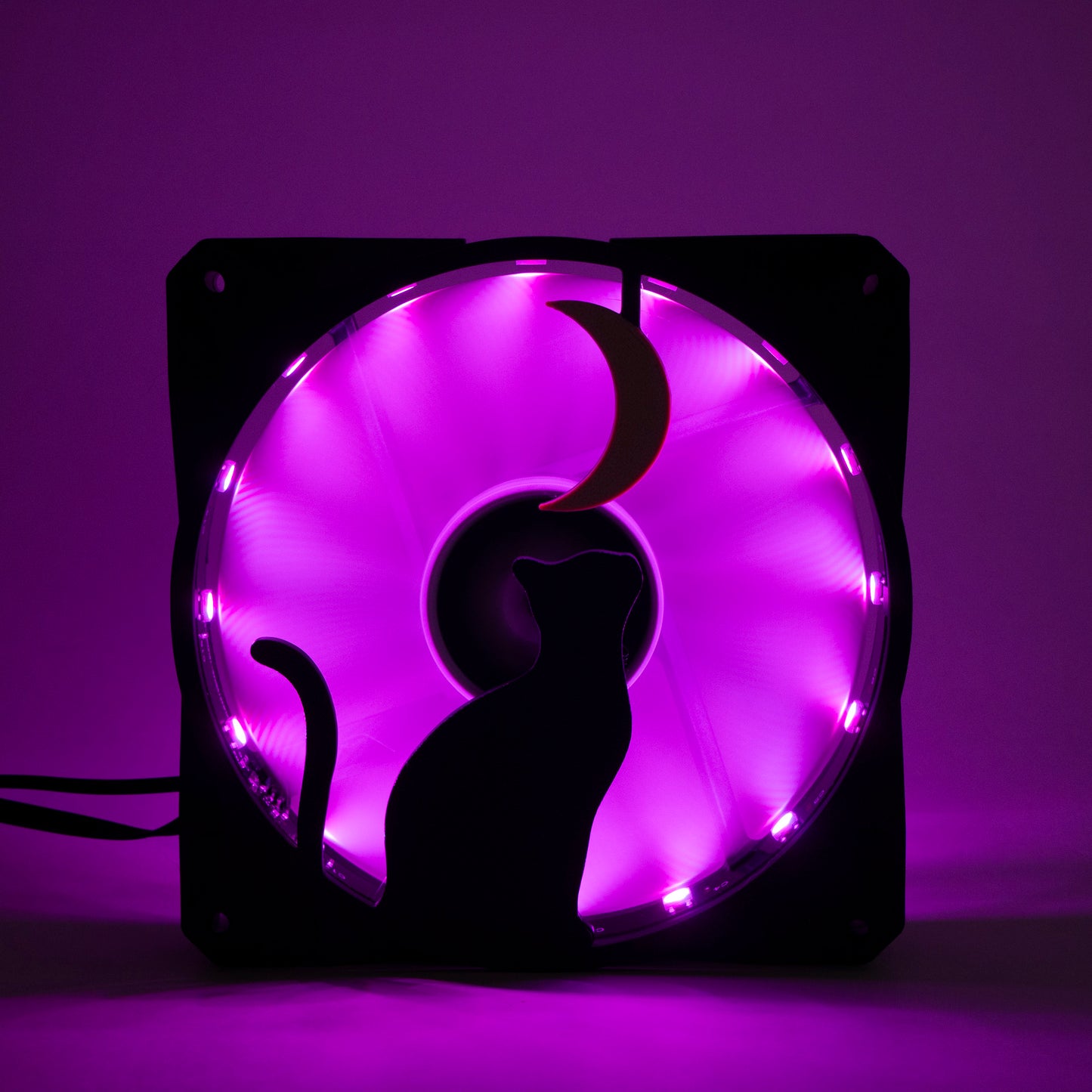 3D printed PC fan grill with a silhouette of a cat gazing at the moon. Perfect for whimsical gaming setups and cat lovers who love custom tech.