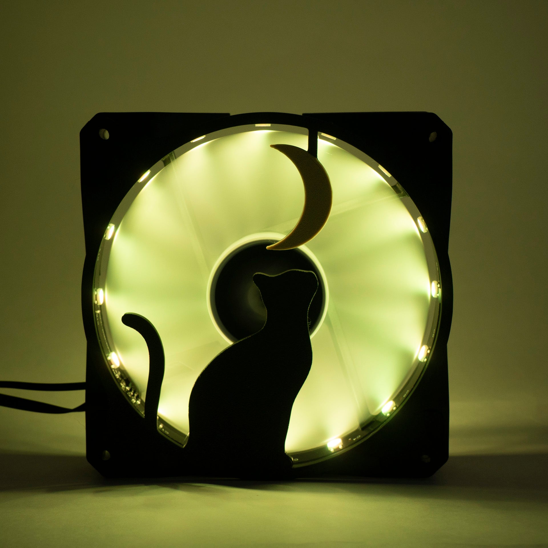 3D printed PC fan grill with a silhouette of a cat gazing at the moon. Perfect for whimsical gaming setups and cat lovers who love custom tech.