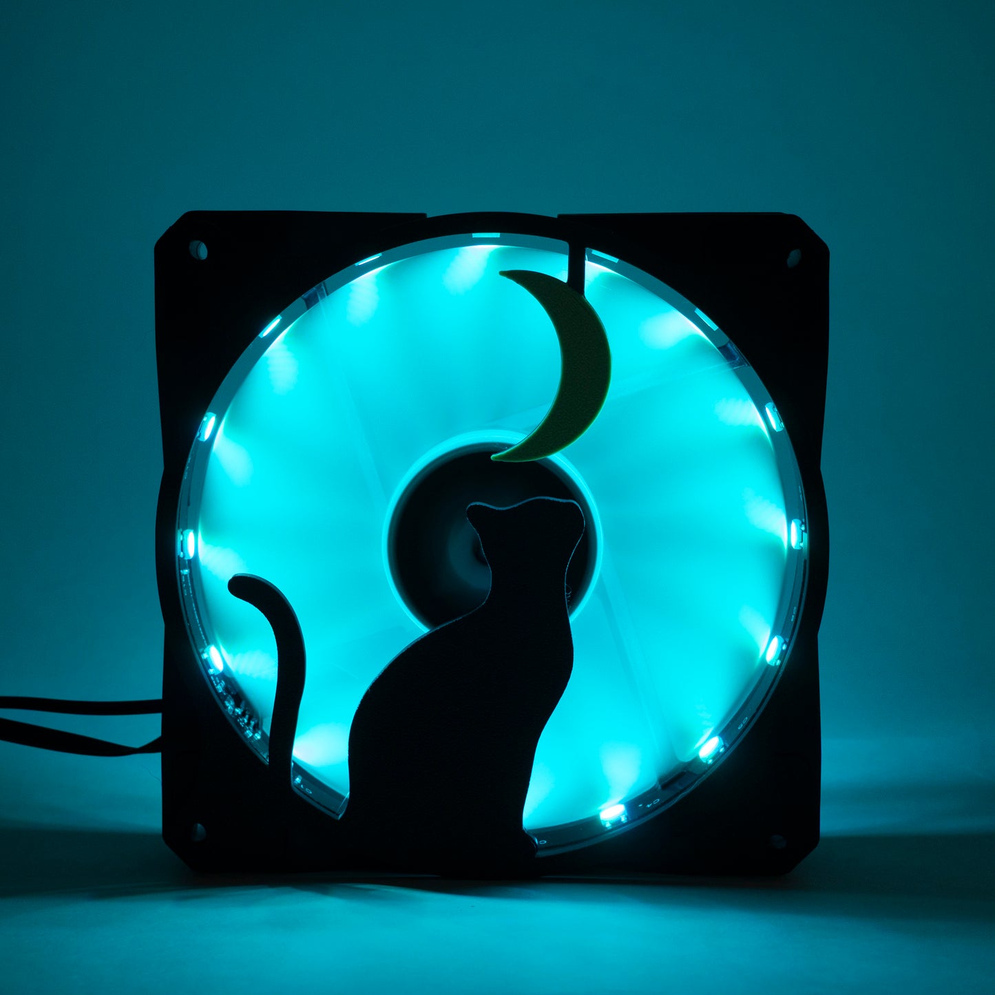 3D printed PC fan grill with a silhouette of a cat gazing at the moon. Perfect for whimsical gaming setups and cat lovers who love custom tech.