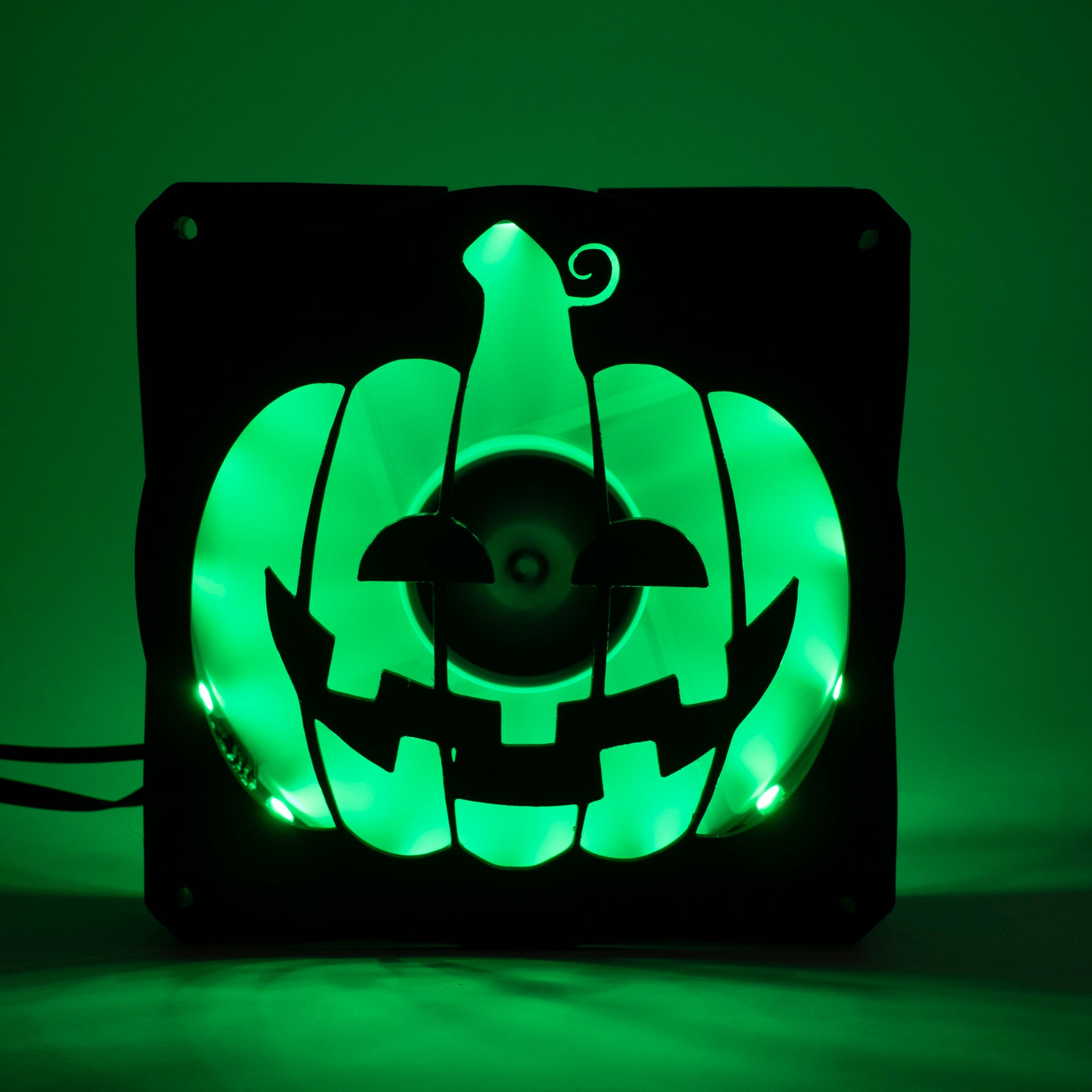 3D printed PC fan grill shaped like a spooky jack-o'-lantern pumpkin. Perfect Halloween-themed case mod for gamers and tech lovers.